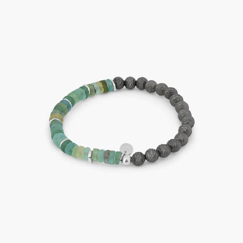 Rhodium Plated Sterling Silver Graffiato Oceana Bracelet with Roman Glass, Size L

This bracelet features authentic pieces of a 2000-year-old ancient roman glass, polished by nature and expertly cut into delicate beads. Rhodium-plated discs separate