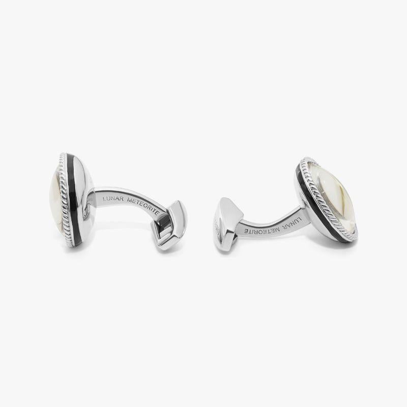 Rhodium Plated Sterling Silver Lunar Meteorite Cufflinks, Limited Edition

These unique cufflinks feature authentic pieces of the moon, found in a meteorite discovered in Morroco in 2013. We have set them inside a rhodium-plated sterling silver bowl