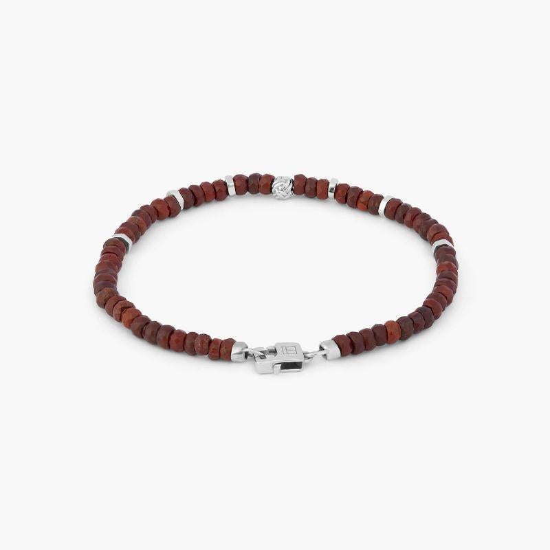 Rhodium Plated Sterling Silver Nodo Bracelet with Rainbow Jasper, Size M

These men's bracelets feature red agate and are finished with a rhodium-plated sterling silver knot bead, discs and matching lobster clasp. The stones are carefully selected