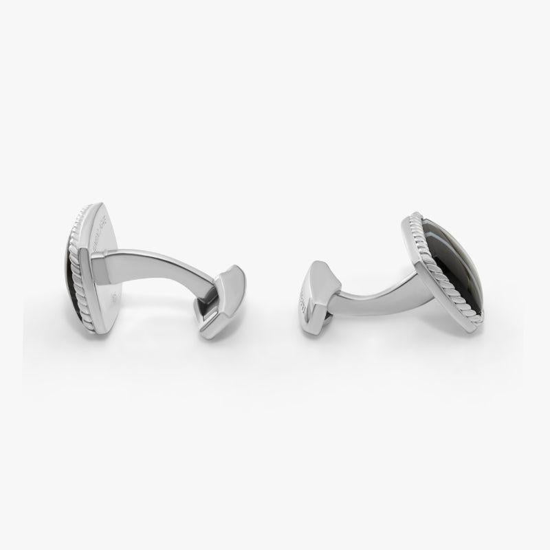 Rhodium Plated Sterling Silver Tuxedo Agate Cufflinks, Limited Edition

Limited Edition cufflinks featuring tonal navy shades that make up the organic nature of these stones, creating a striped effect giving in the name “Tuxedo Agate”. These pieces