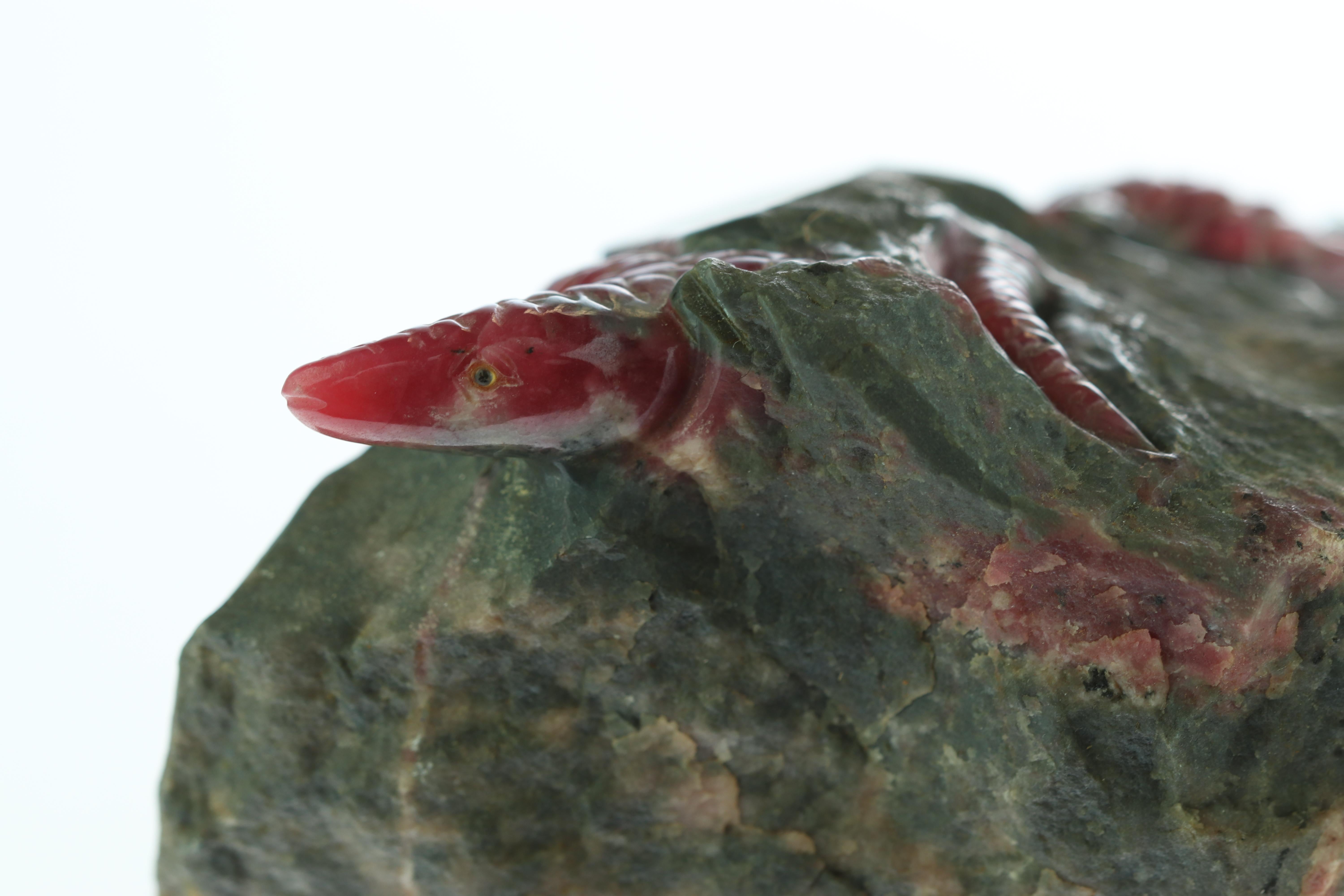 A natural scene hand carved in a natural precious stone with a mineral quartz base, what can you ask more? This collection features first quality Rhodochrosite worked directly in its matrix rock stone, setting the tone for a vivid, realistic art