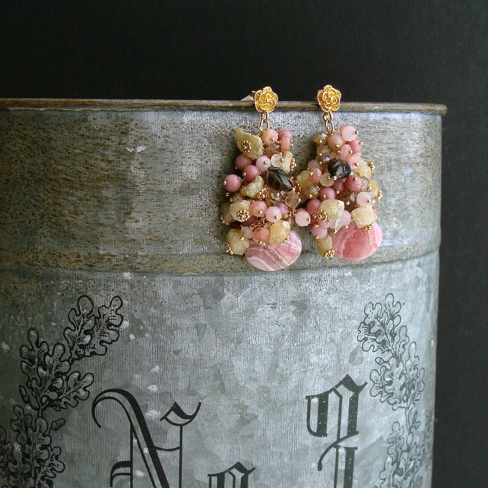 Fleurs XIX Earrings.

Unique Missoni-style striped rhodochrosite briolettes in honeysuckle pink, bamboo, coffee liqueur and nougat colors are juxtaposed with generous clusters of champagne topaz, rhodonite, pink jade, rose quartz, raw  Herkimer