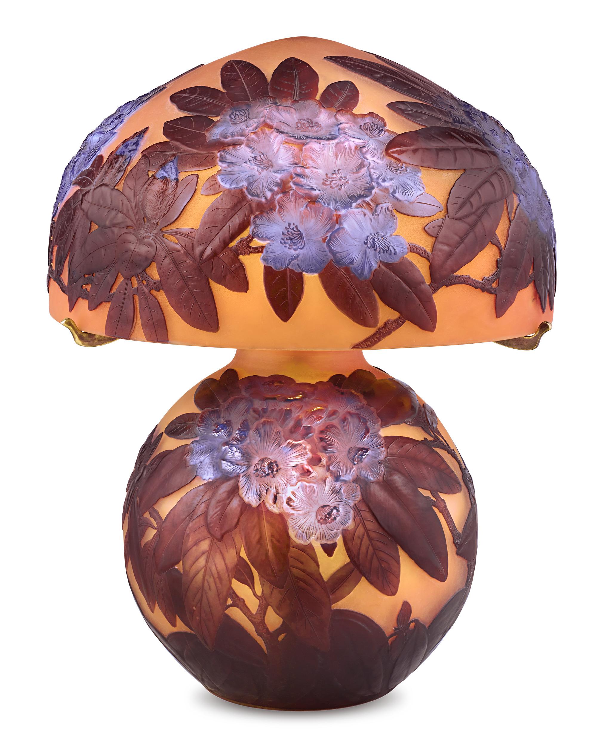 Impressive in both size and artistry, this exceptionally rare mold-blown cameo glass lamp is the work of the famed Art Nouveau master Émile Gallé, one of the most highly regarded names in French glassmaking. The artist's appreciation of nature is