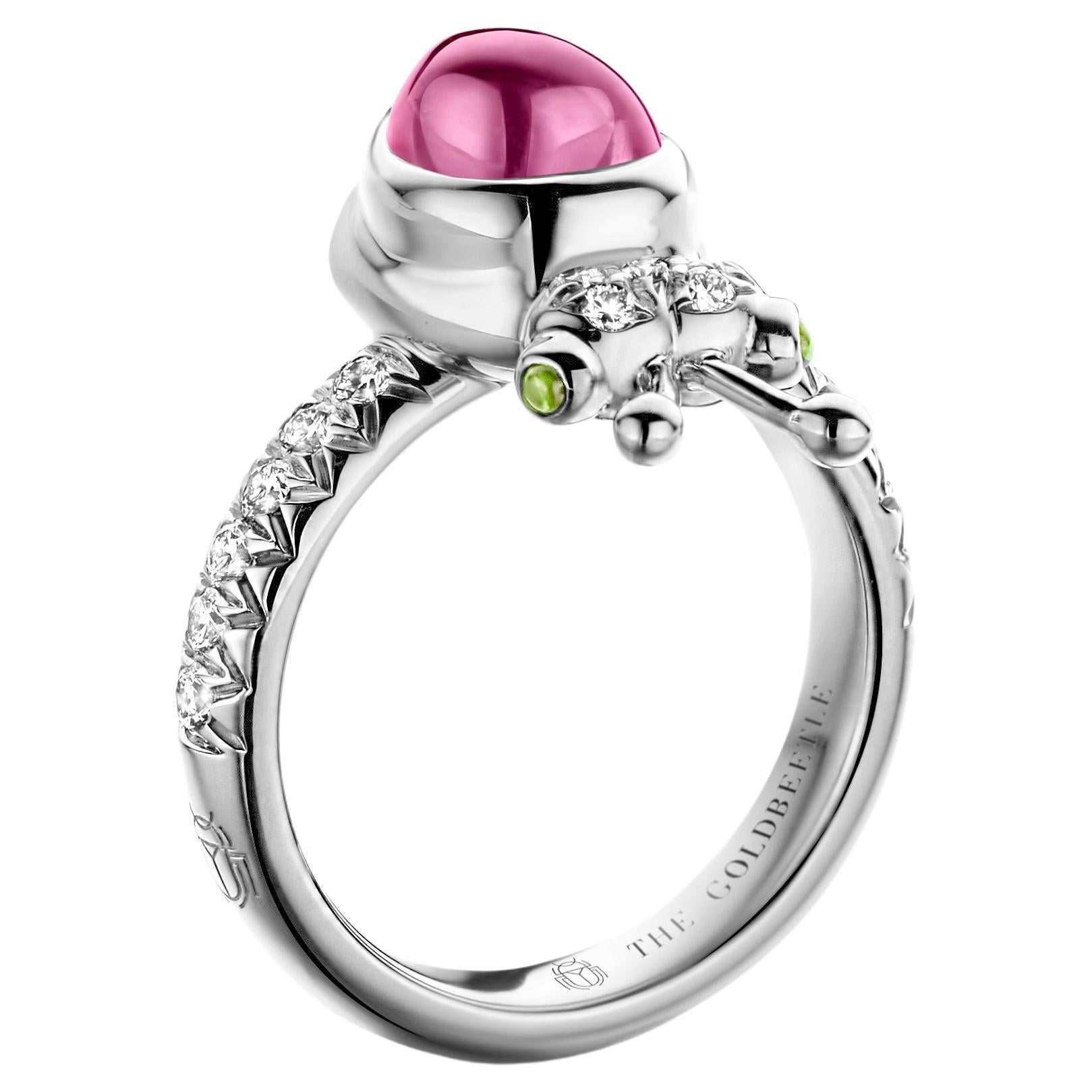 One-of-a-kind lucky beetle ring in 18 Karat white gold 8,6 g set with the finest diamonds in brilliant cut 0,34 Carat (VVS/DEF quality) one natural, rhodolite garnet in pear cabochon cut and two tsavorites in round cabochon cut.
