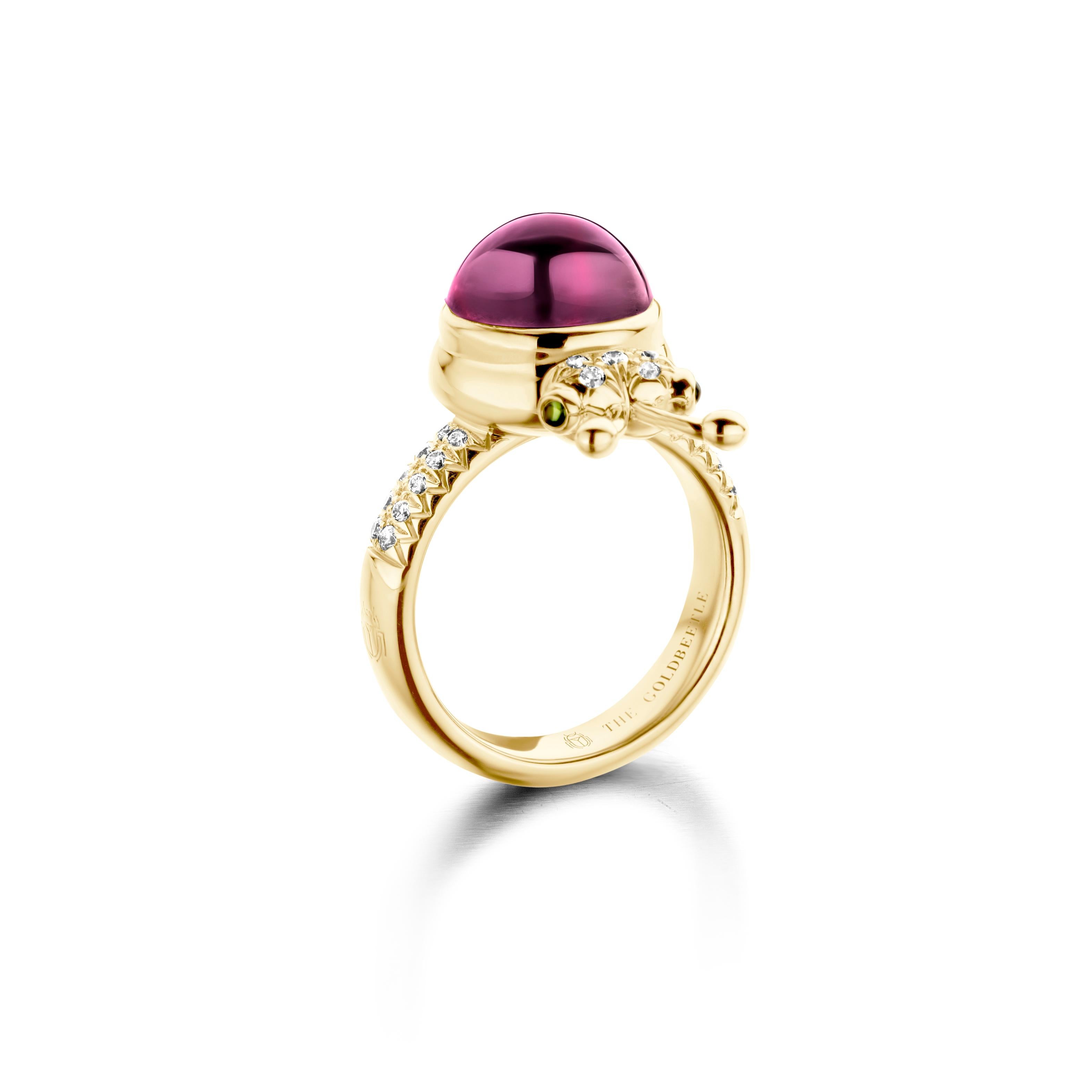 One-of-a-kind lucky beetle ring in 18-Karat yellow gold 10g set with the finest natural diamonds in brilliant cut 0,23 Carat (VVS/DEF quality) one natural, rhodolite garnet in round cabochon cut 6,00 Carat and two tsavorites in round cabochon cut.
