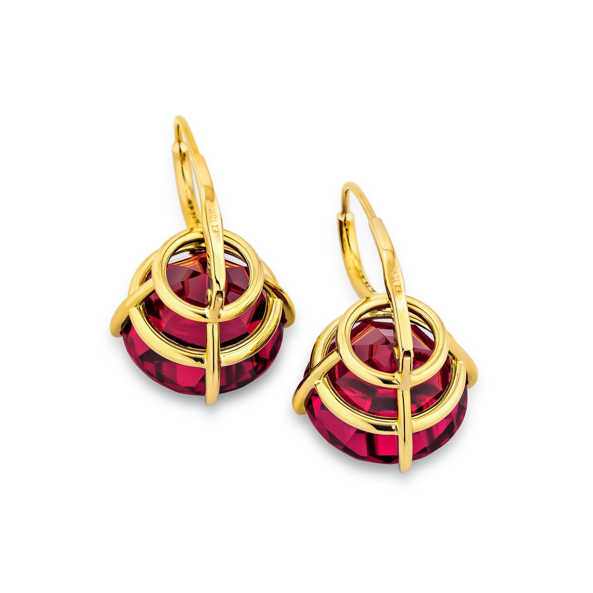 Deep and luscious rose red vintage cut rhodolite garnets move seductively from diamond and gold wires creating a pair of irresistibly wearable and timeless earrings.  Total rhodolite weight 26.48 carats.  Total diamond weight .05 carats.  18 karat
