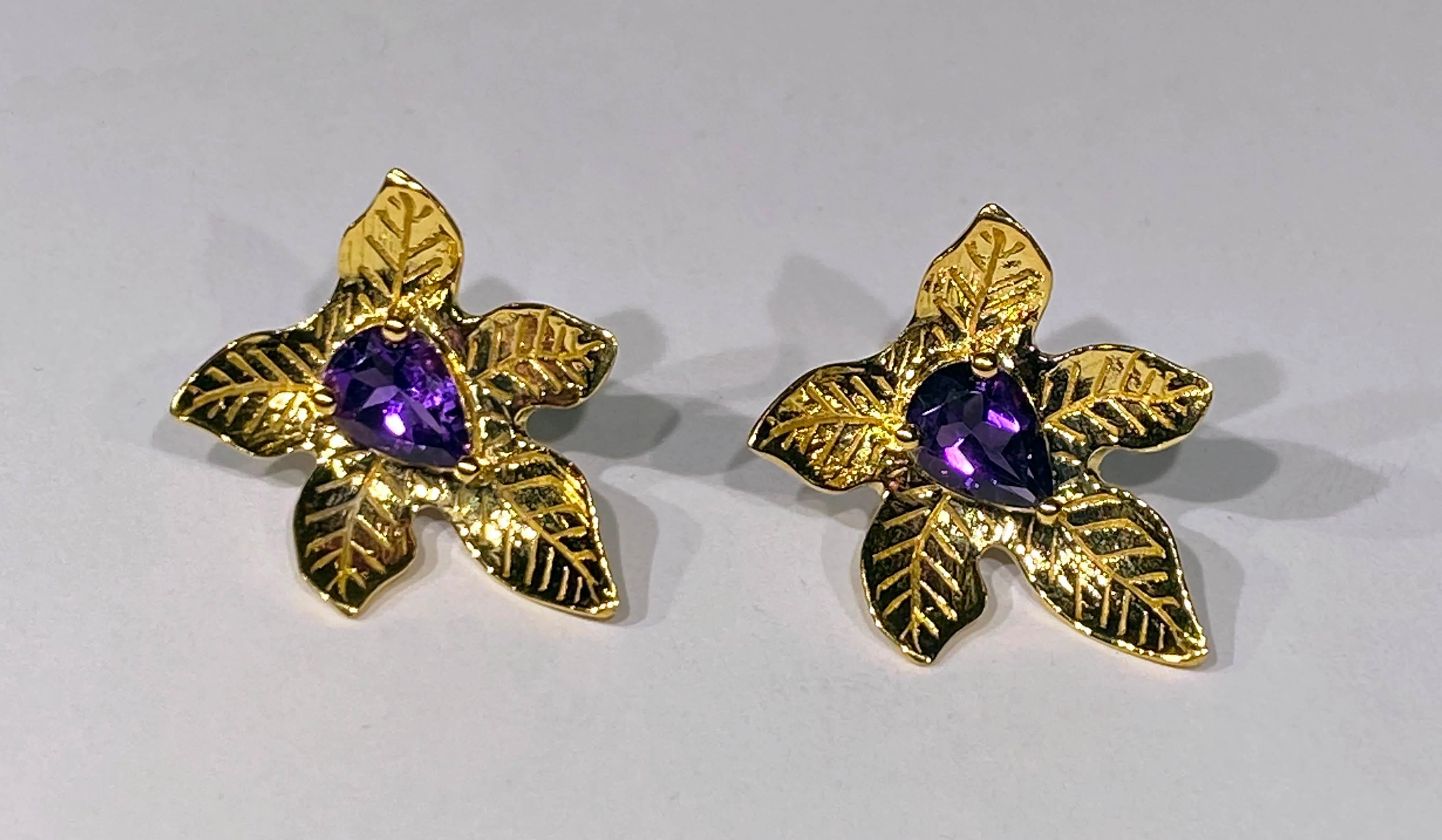 A lovely pair of Gold Plated Silver Leaf Stud Earrings set with Pear Shaped Amethyst TW 1.6 Carats. These Earrings are Gold Plated.

Originally from San Diego, California, Kary Adam lived in the “Gem Capital of the World” - Bangkok, Thailand,