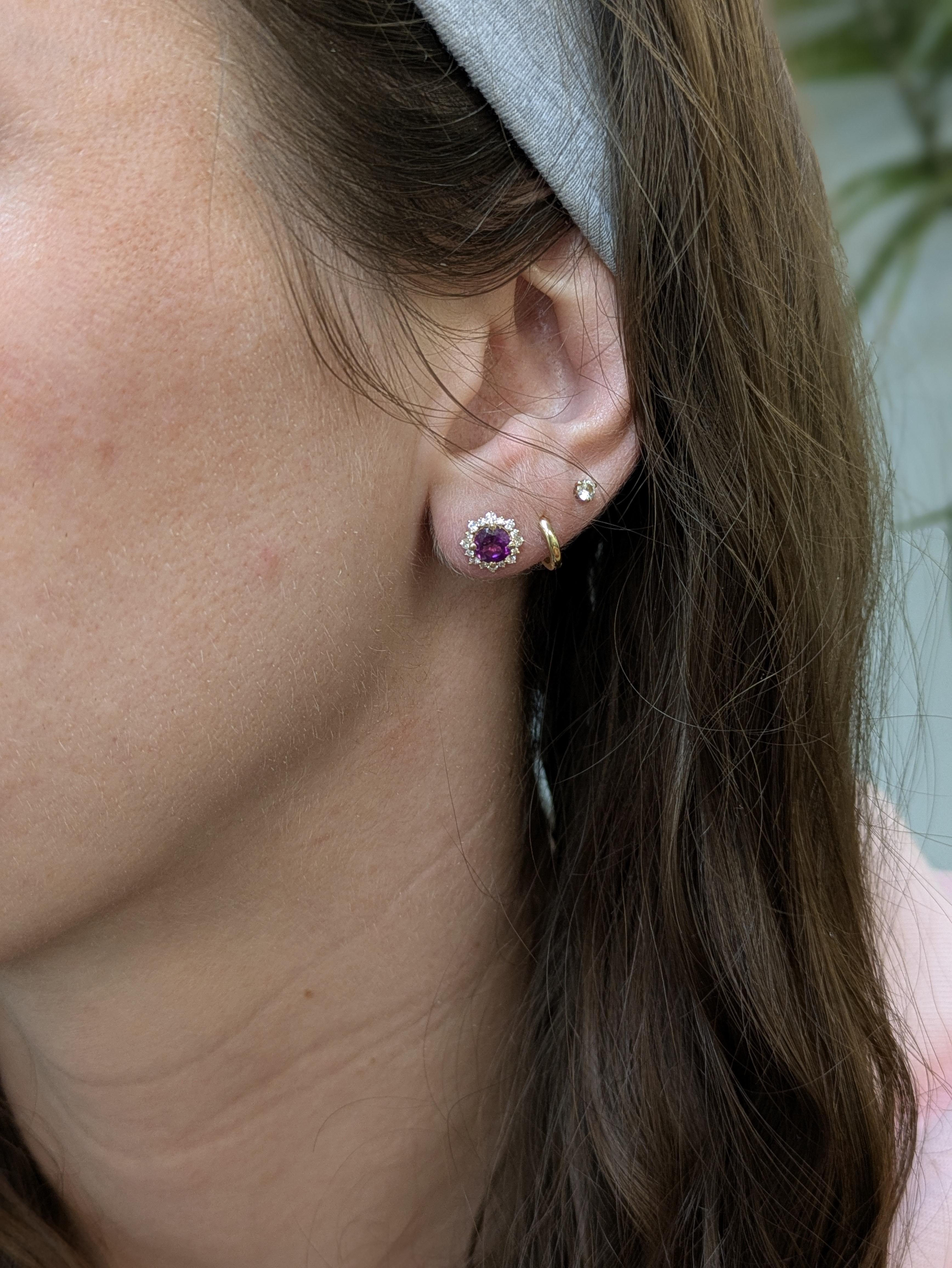 These elegant earrings feature round rhodolite garnets (5mm, ~2.5cttw) from Madagascar, accented by 32 shimmering diamonds (0.30cttw) in a sleek 14K gold setting (2.03g). A perfect pop of color and sparkle for any occasion.

Specifications:

Item