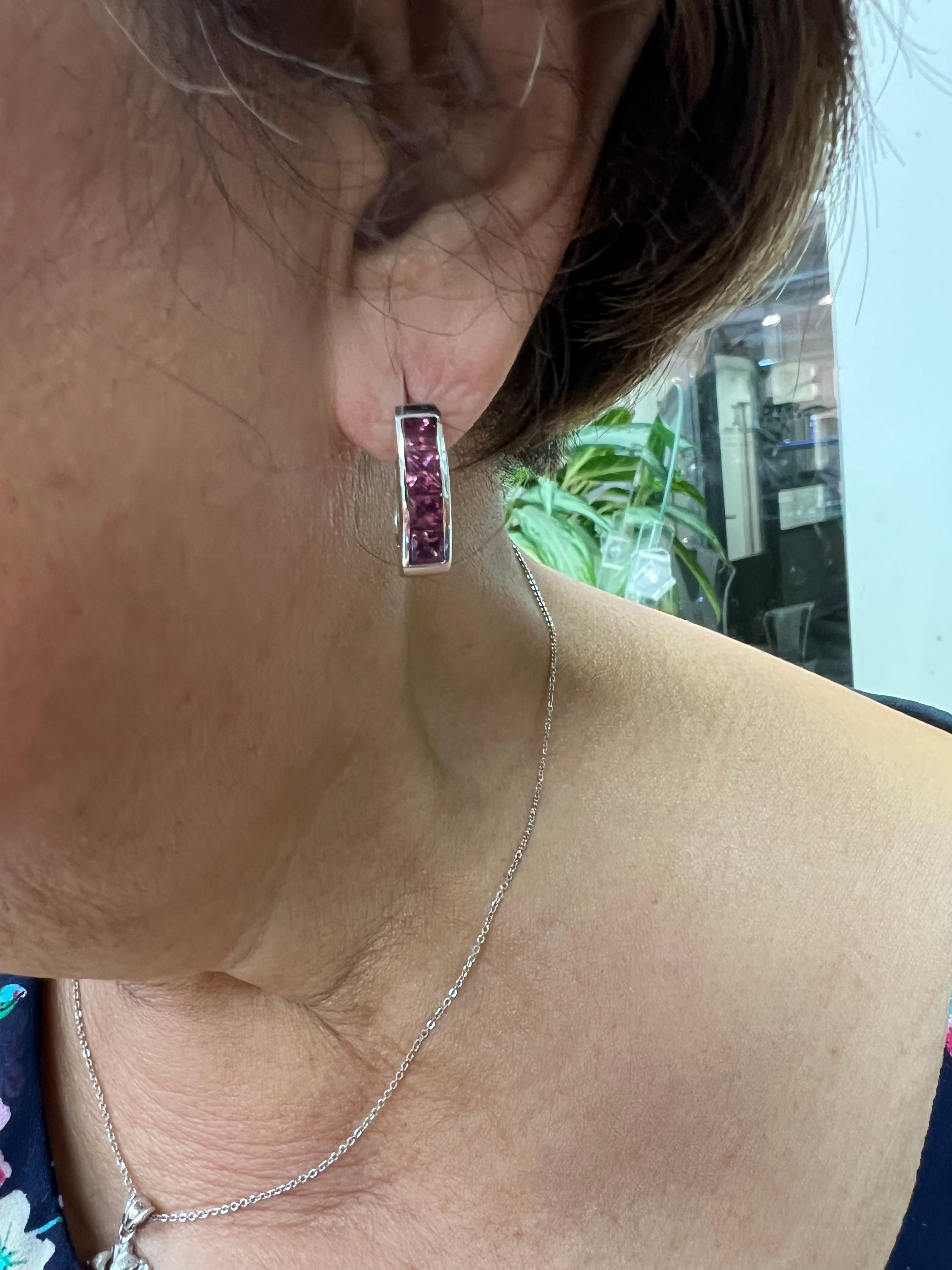 Rhodolite Garnet white gold reversible hoop earrings, 

The Rhodolite Garnet 14k white gold hoop earrings are designed as oval hoops that can be worn two different ways.  They can be worn with the garnets in the front or as plain shiny white gold