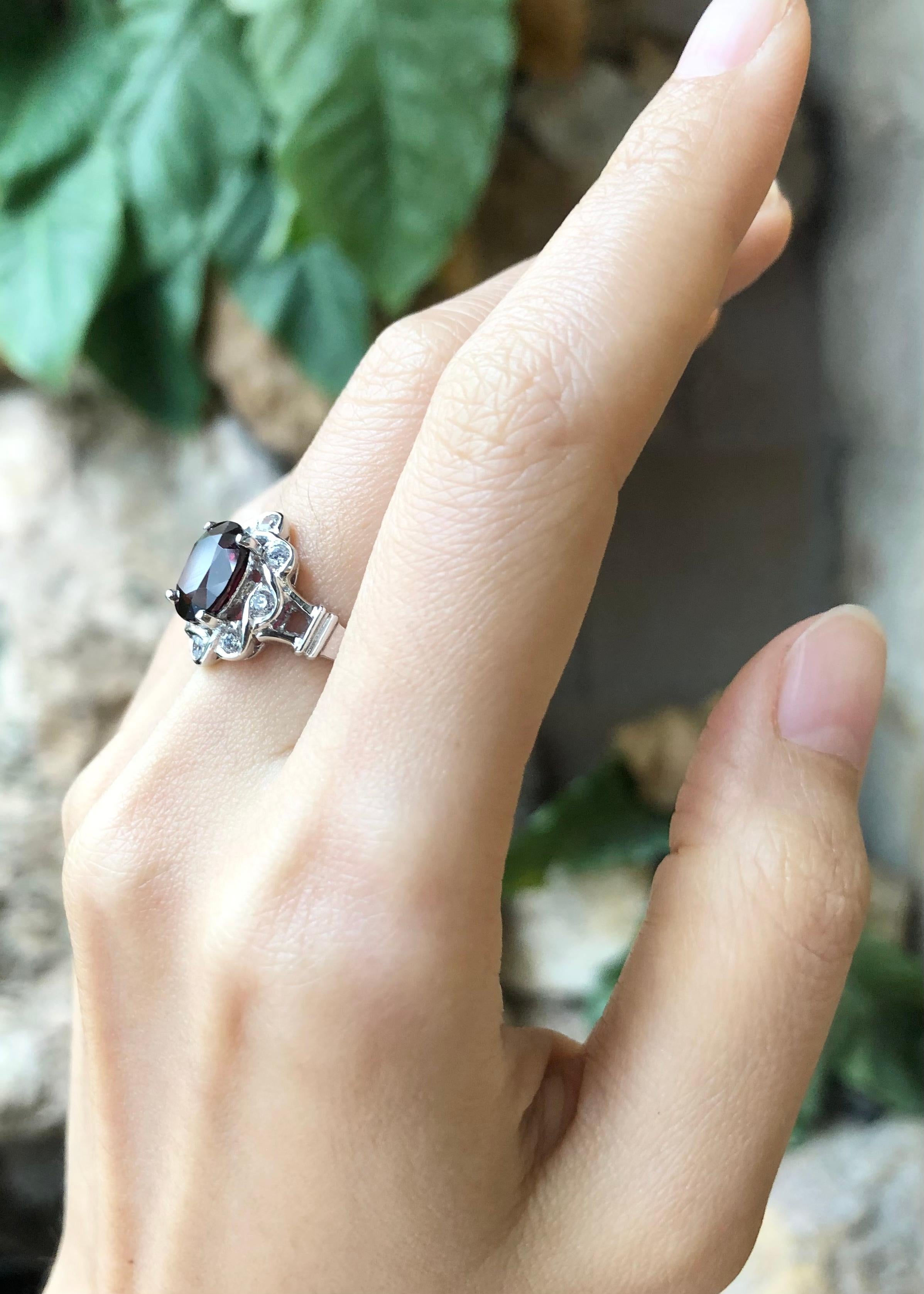 Oval Cut Rhodolite with Cubic Zirconia Ring set in Silver Settings For Sale