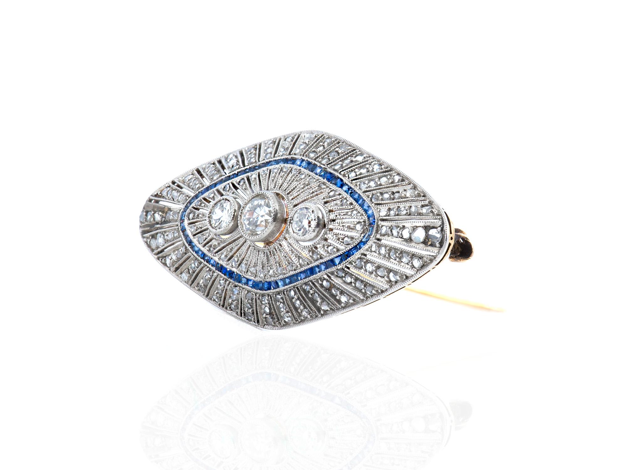 The brooch is finely crafted in platinum and 18k gold with diamonds weighing approximately total of 3.00 carat and sapphire weighing approximately total of 1.50 carat.