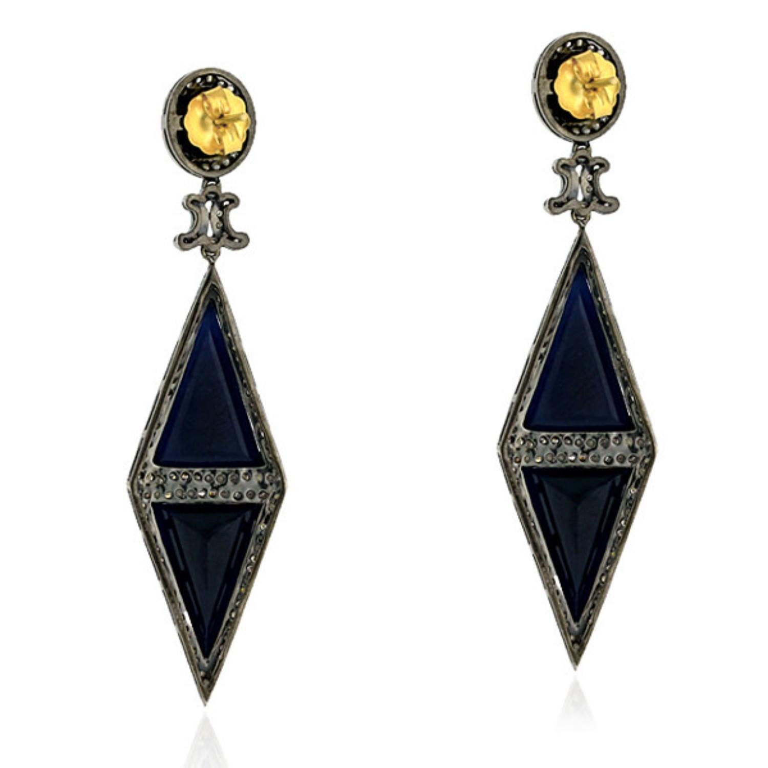 Add some sophistication to your jewelry collection with these Rhombus Shaped Blue Sapphire Earrings. Featuring a beautiful blue sapphire at its center, these earrings are set in a striking combination of 18k gold and silver. Pave diamonds add a
