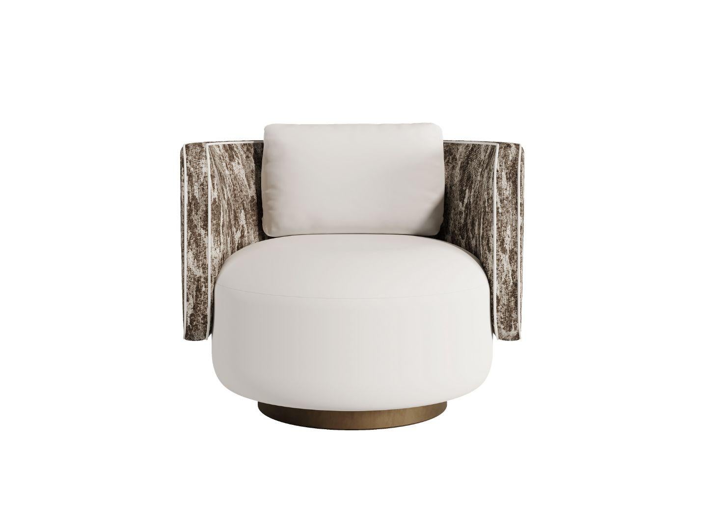 The RHONDA armchair from the Essence collection offers a blend of sophistication and comfort with its smooth, rounded backrest and spacious seat that extends gracefully to the base. Equipped with a swivel function, this armchair provides ease of
