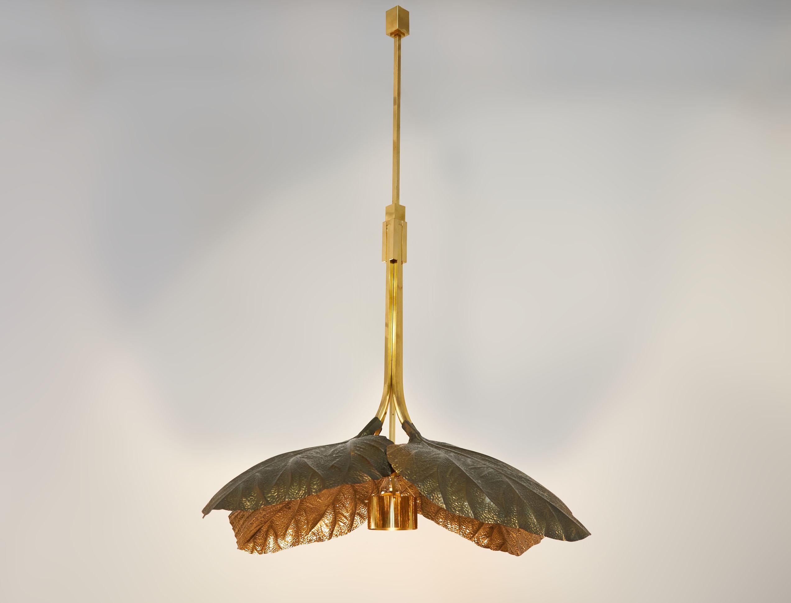 A very rare, impressive and sought after rhubarb leaf brass chandelier, designed by Tommaso Barbi,  edited by Bottega Gadda, Milano, Italy, 1970s 

Made to order for an important staircase, the extra-height of the chandelier can easily be modified,