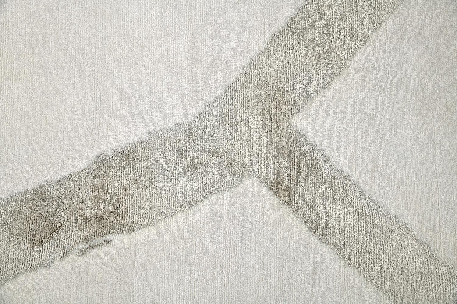 The simple gestures of a painting are captured and preserved in silk on a wool field. The champagne silk shapes are sophisticated yet playful. “Rhyme or Reason” is perfect if you wish to introduce some edge to a room or counter an overly serious