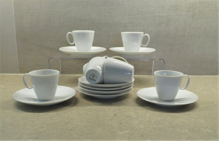 From the iconic Coupe Form dinnerware, created by Raymond Loewy for Continental China in the 1950s, a White Rhythm Mocha / Demitasse/ Espresso Coffee Set in excellent condition.  The set includes 8 cups and saucers and one open sugar bowl. The