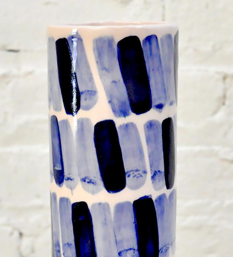Hand-built porcelain vase by Isabel Halley, in hand-dyed ballet pink with striking cobalt glaze brush strokes.

Dimensions: 8