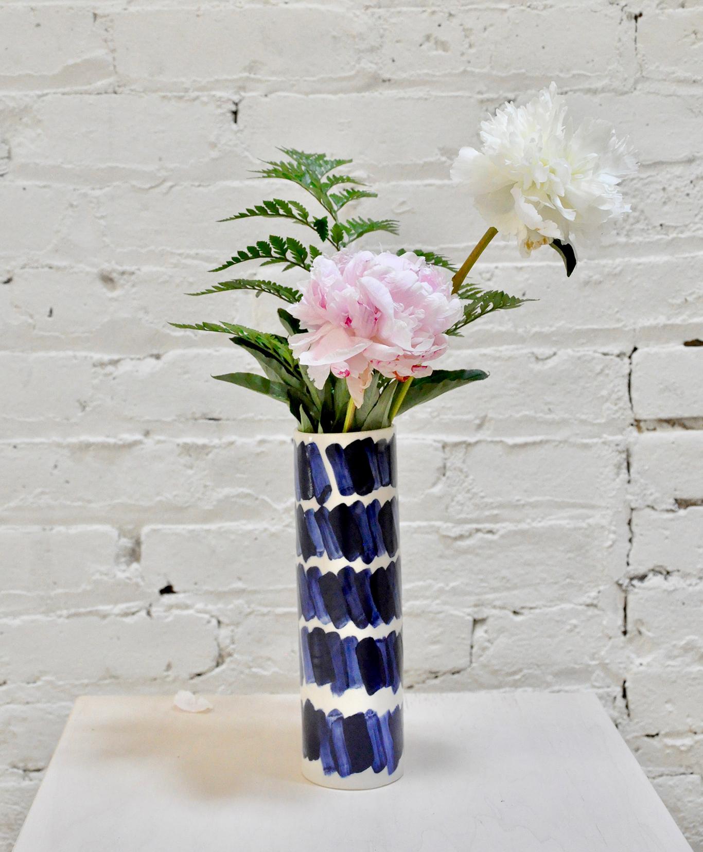 Hand-built vase by Isabel Halley, in creamy white porcelain with striking cobalt glaze brush strokes.

Dimensions: 8