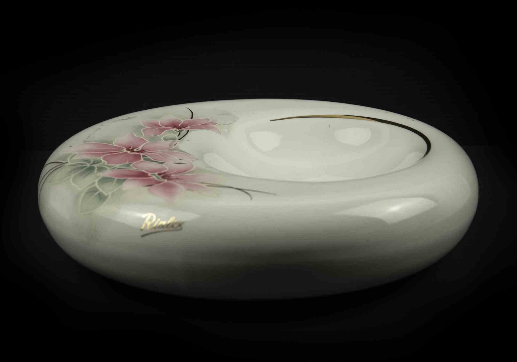Rialex Ceramix centerpiece is an original object realized in the mid-20th century.

Original fine porcelain with hand-made decoration and golden details. 

Made in Italy. 

On the base the label and the written 
