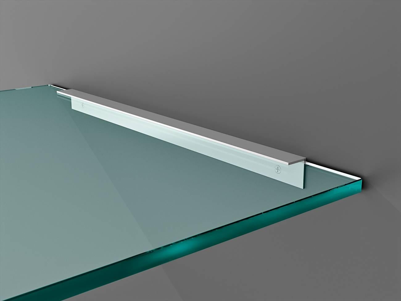 Desk in 15 mm thick transparent curved glass with a double bright finish aluminum pate for wall mounting. Available in custom size.