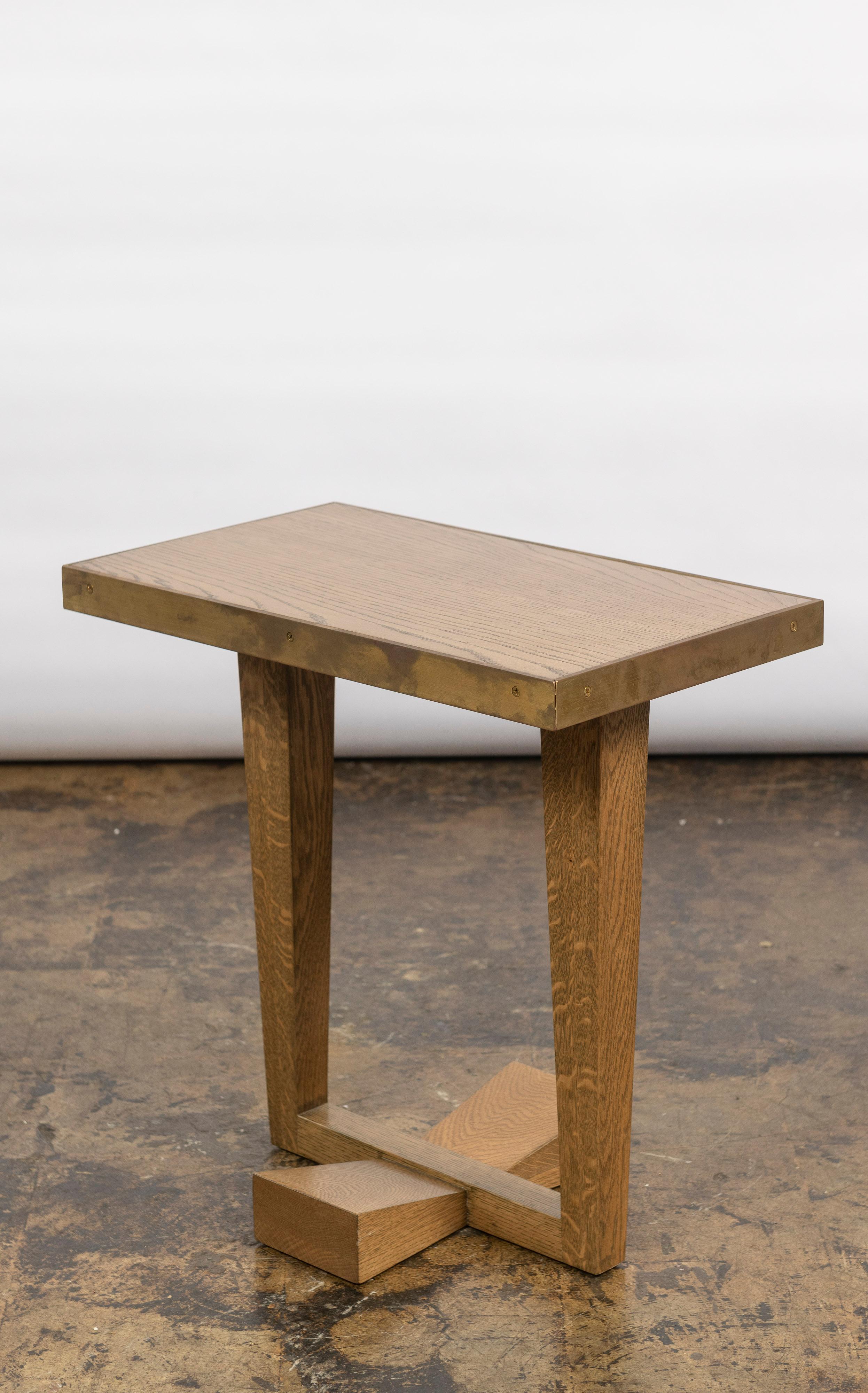 The Rialto side table is made from American walnut or white oak, features a lacquered brass banding and is made in California. Perfect size for so many places in a residence. Excellent construction.