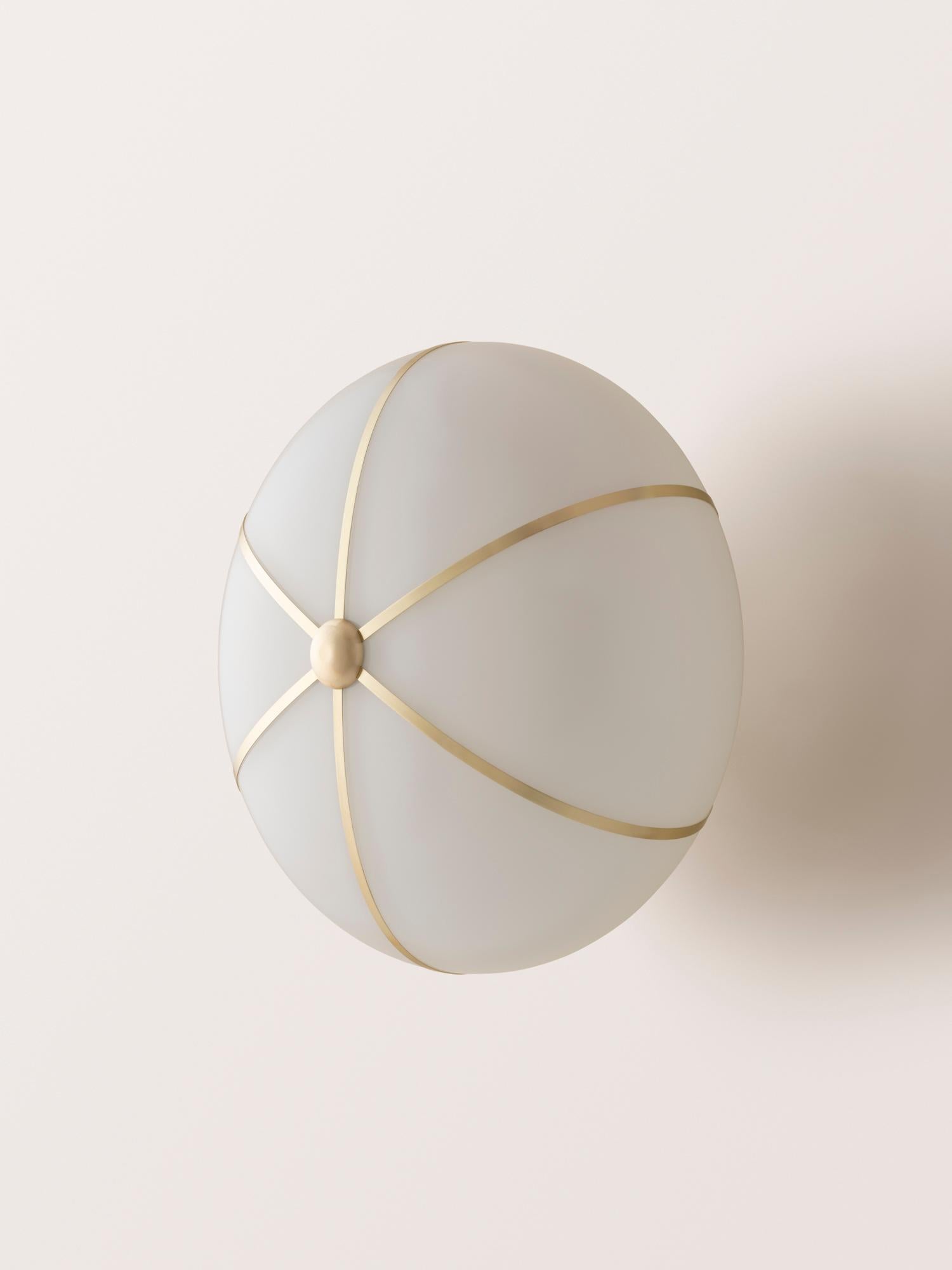 The Rib Sconce - Large Ellipse is blown in Italy and delicately framed by thin brass ribs.

This listing is priced in the satin brass finish. Please inquire for pricing of other finish options.
