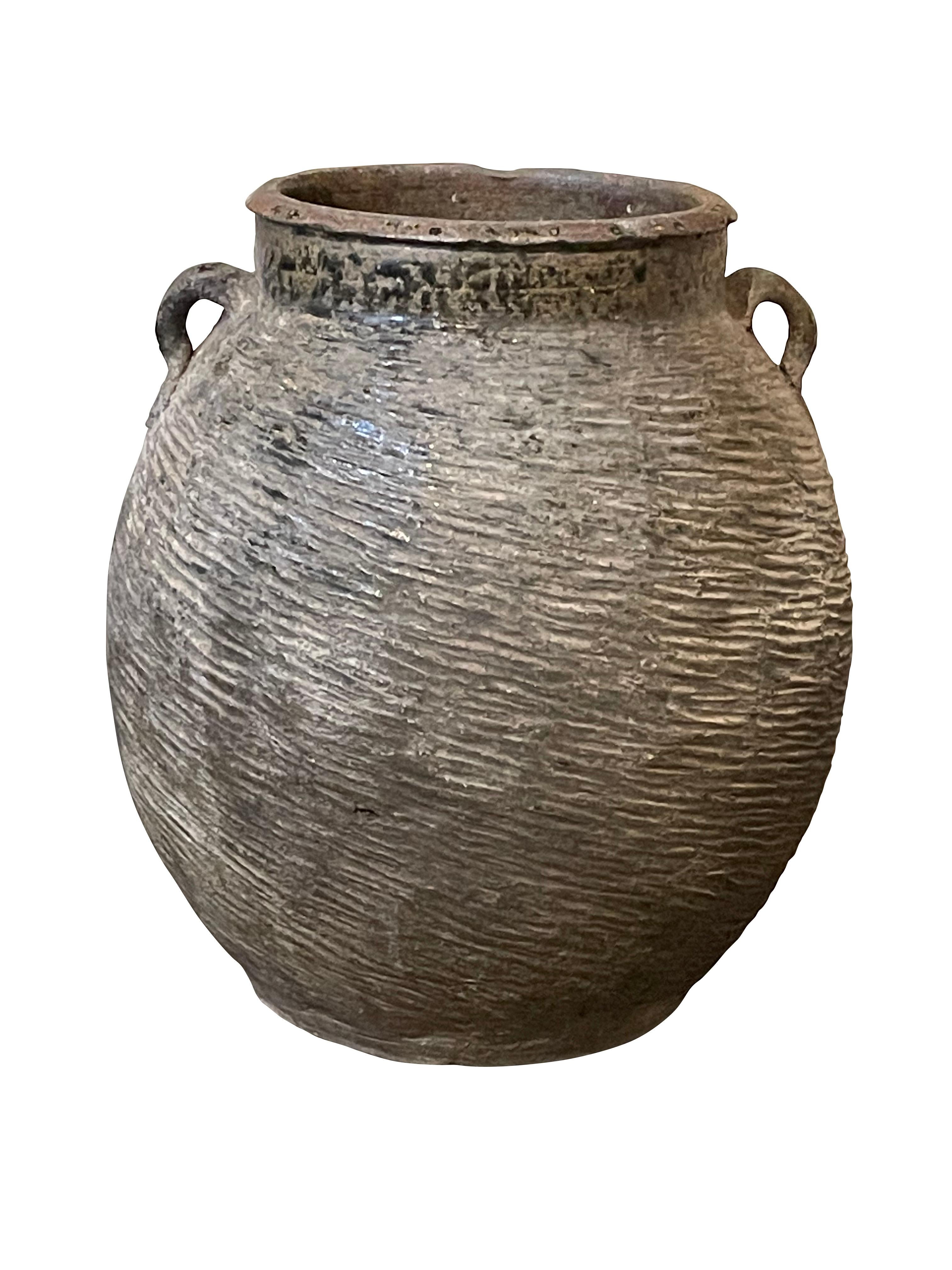 1940's Chinese horizontal rib textured vase with two small handles.
Weathered brown color.
Two available and sold individually.