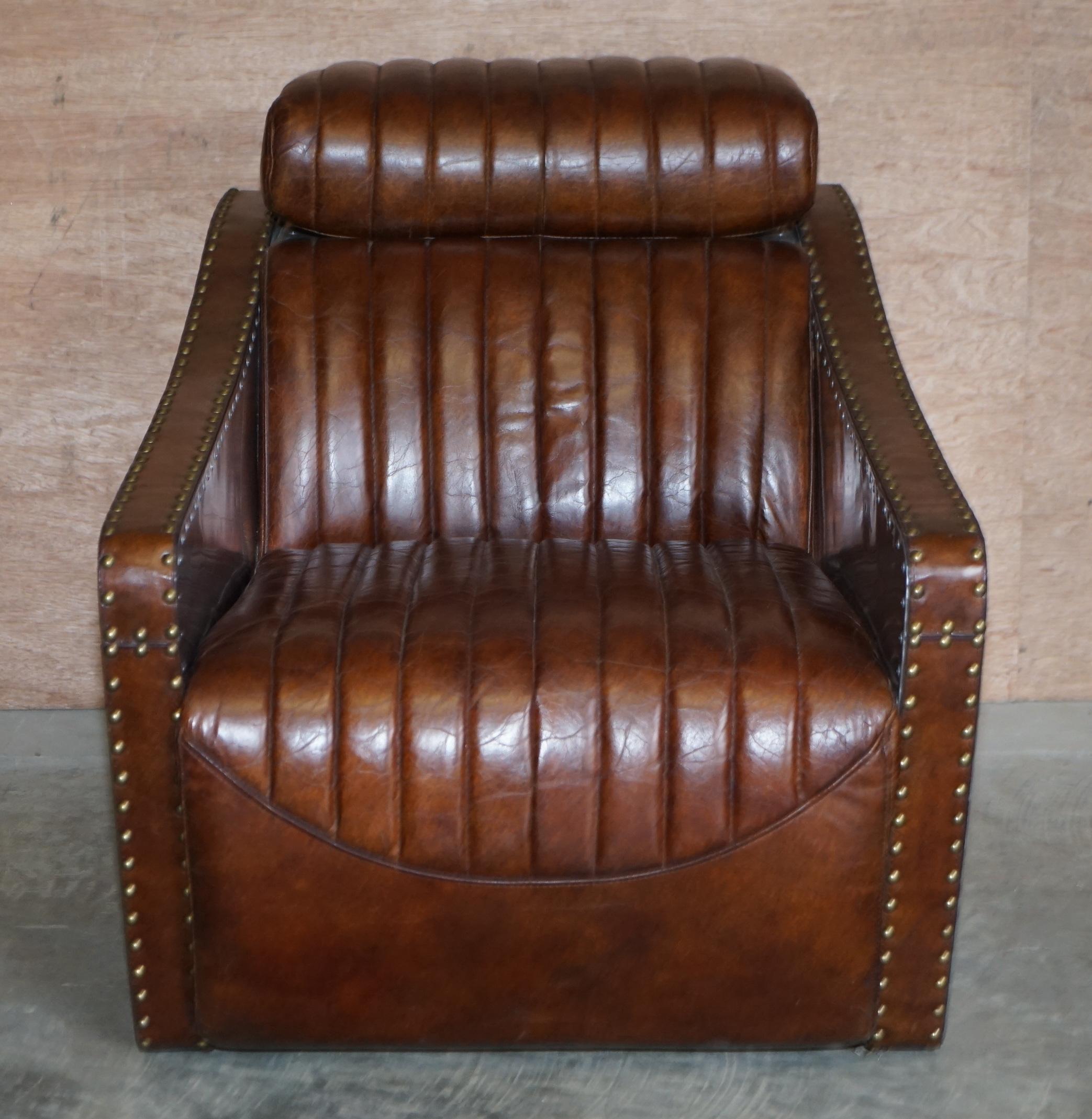 We are delighted to this sublime hand dyed ribbed brown leather Aviator armchair with studded aluminium frame and adjustable head rest

A very comfortable. Well made and dare I say it cool looking armchair made in the Aviator style. The head rest