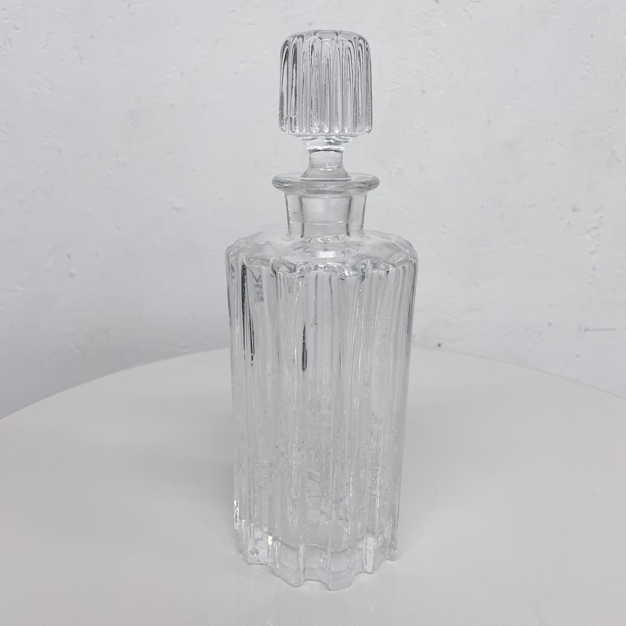 Decanter
Handsome mid-century ribbed glass carafe bottle decanter Modern Brutalist design with controlled bubbles
In the style of Tapio Wirkkala Finland
Includes matching lid-stopper -it has a small nick, please refer to images.
Measures: 10.63