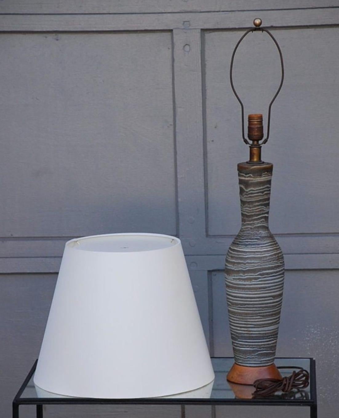 Ribbed salt glaze ceramic lamp by Lee Rosen for Design Technics. Also in the style of Alberto Giacometti for Jean-Michel Frank. Shade Dimensions: 12.5 in. tall x 16 in. diameter at base.