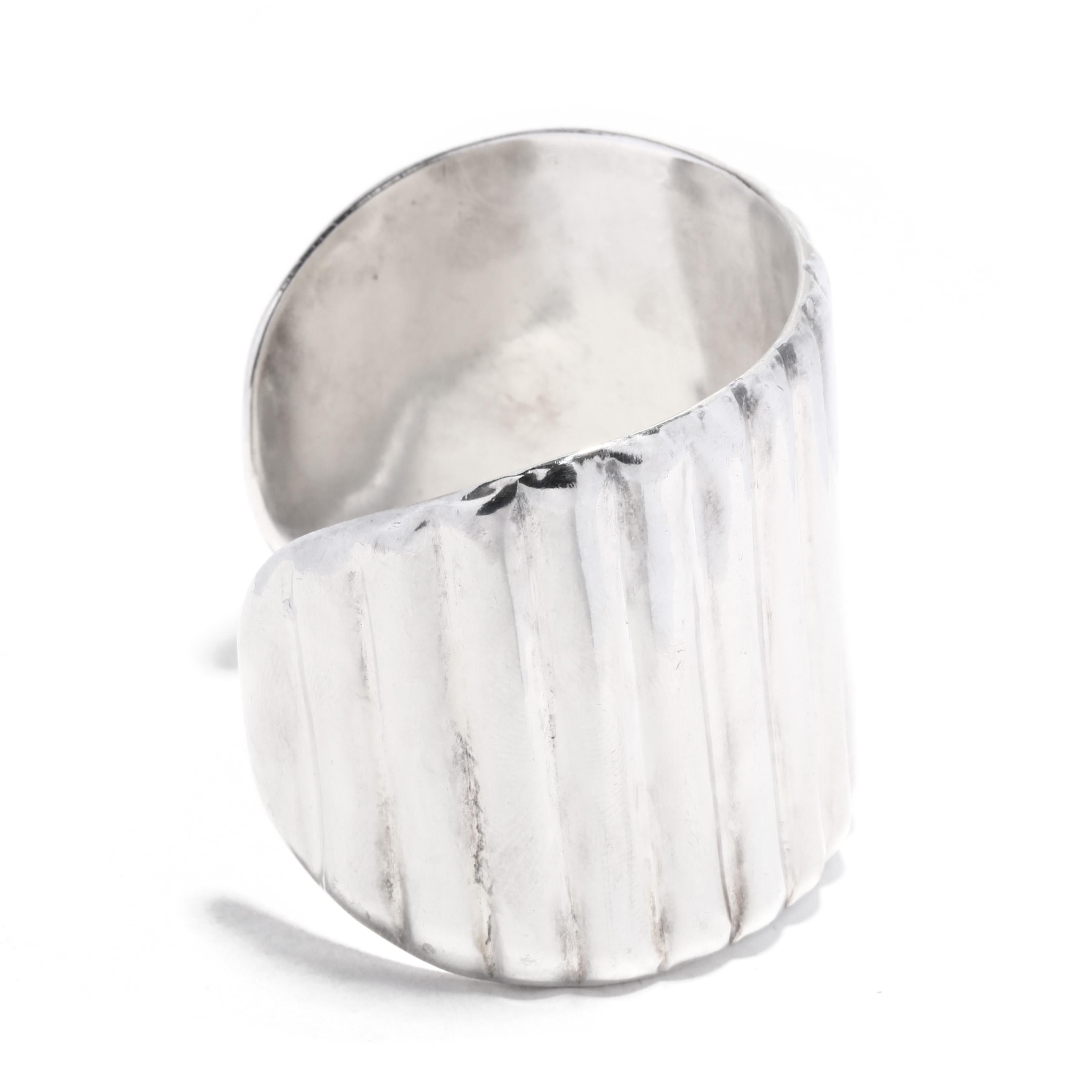 This stunning sterling silver cuff bracelet is the perfect accessory for any occasion. Handcrafted in Mexico, this ribbed silver cuff is made from sterling silver and measures 6.5 inches in length and 1.5 inches in width. This cuff features