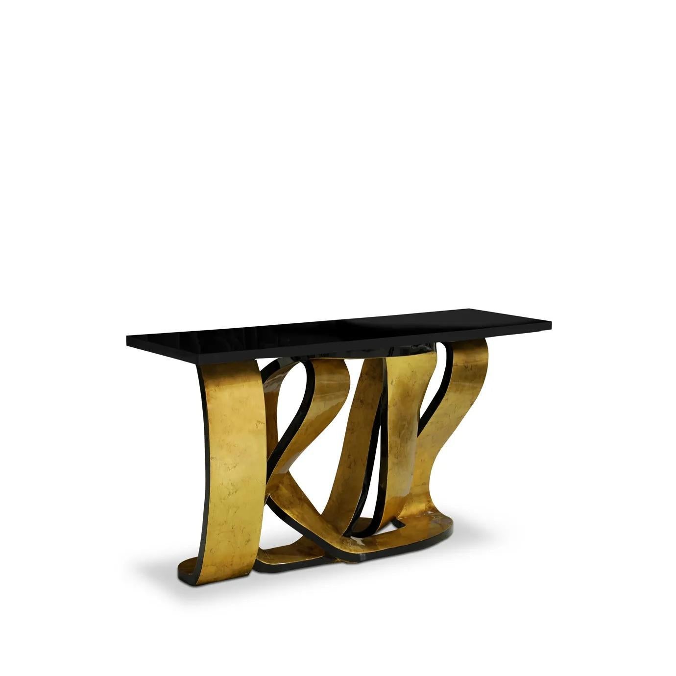 Get wrapped up in the rhythmic design of the Ribbon console table. The provocative twists and turns of the base are delicately adorned in gleaming metalic leaf, mimicking the sheen of a girl's hair ribbon. The luxury console table's playful base is