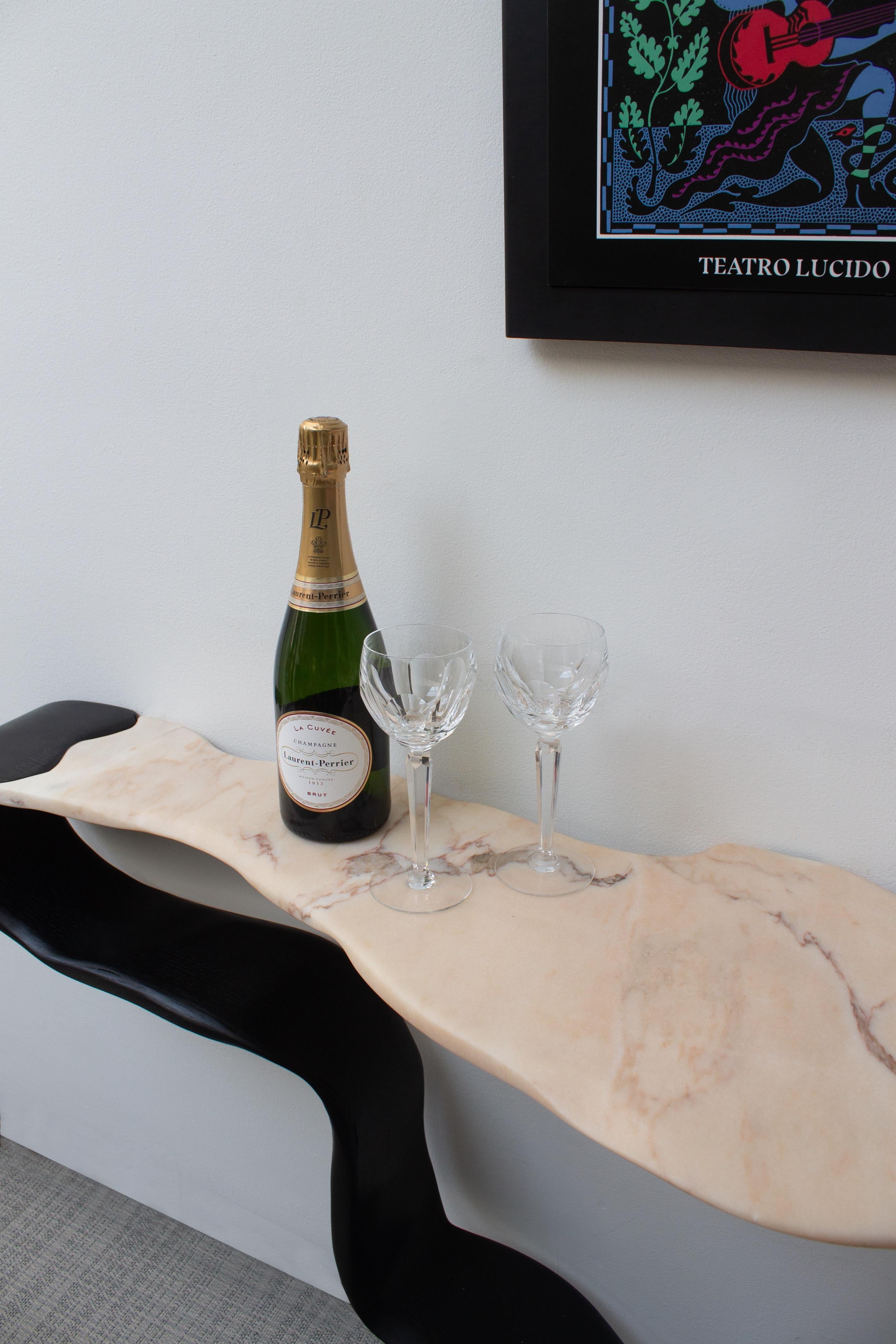 This is the newest piece in our Ribbon Collection. We are very excited to be using this beautiful marble along side the ash veneers. This particular piece of marble was handpicked from our supplier and shaped in our workshop. The joining of the