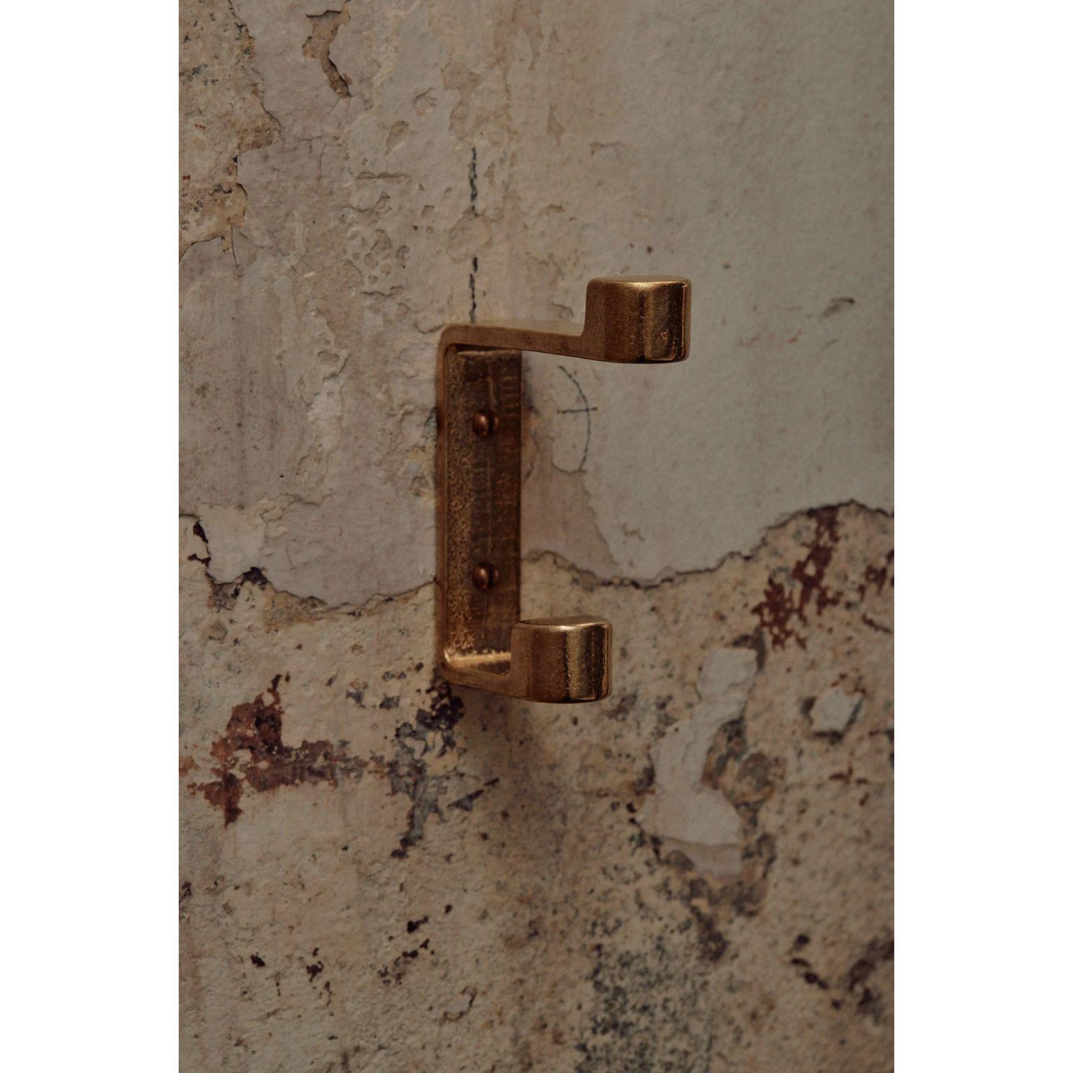 Brass Ribbon Hook by Henry Wilson
Dimensions: W 2 x D 8 x H 12 cm
Materials: Brass

The Ribbon Hook is sand cast in solid brass. Ribbon hook has two protruding blocks to allow you to hang multiple pieces on the one fixture.
Our Hooks are