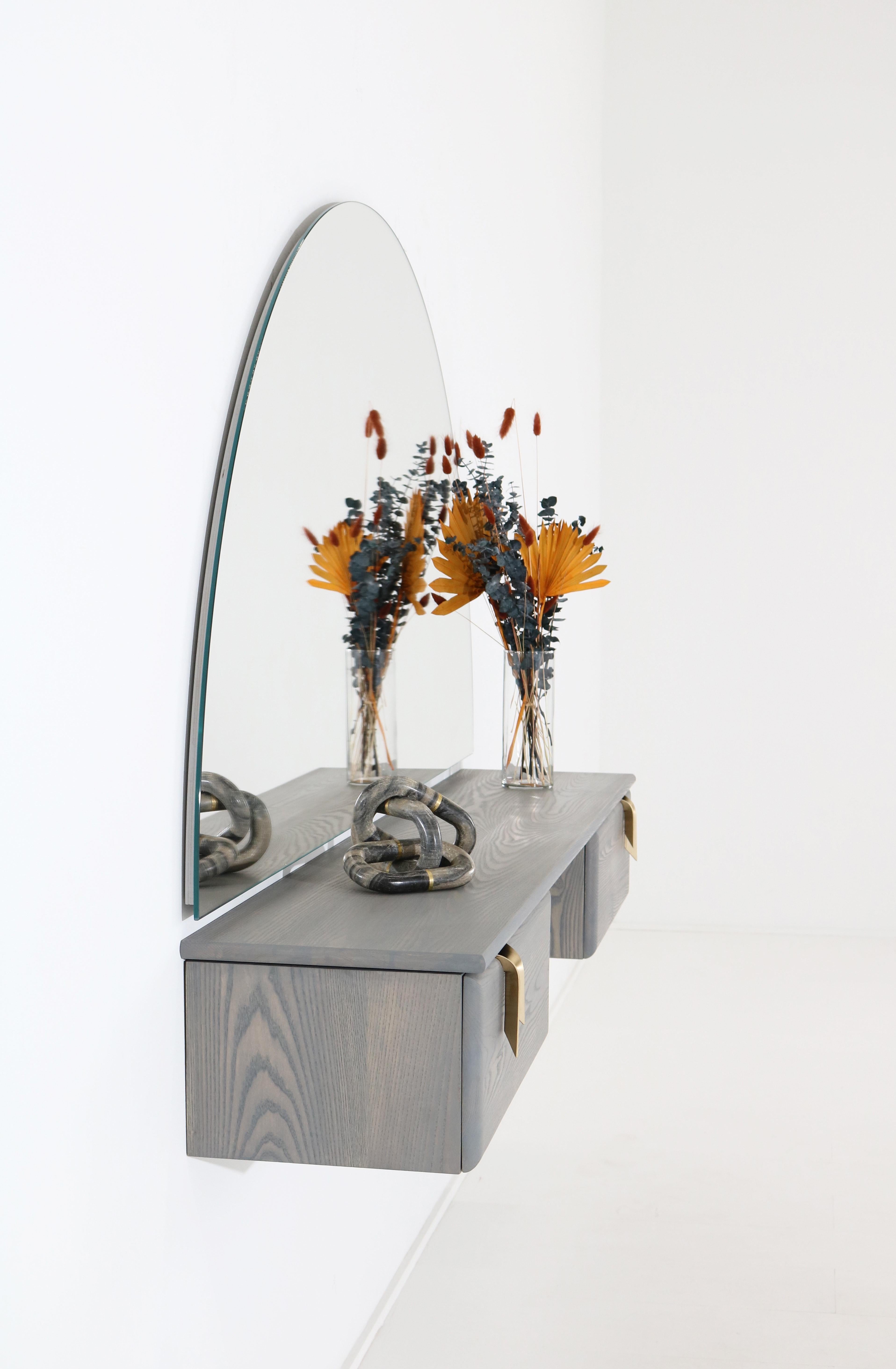 gray vanity with bronze hardware