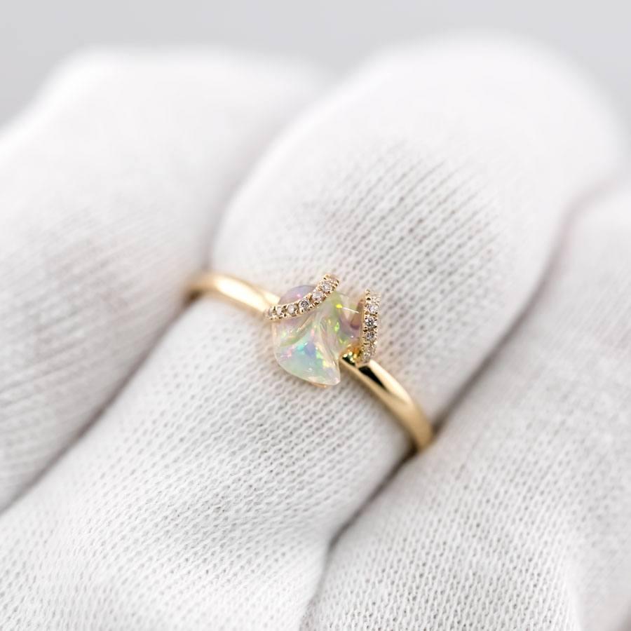 Ribbon Wrap Design Mexican Fire Opal Diamond Engagement Wedding Ring in 18K Yellow Gold.


Free Domestic USPS First Class Shipping! Free Gift Bag or Box with every order!

Opal—the queen of gemstones, is one of the most beautiful gemstones in the