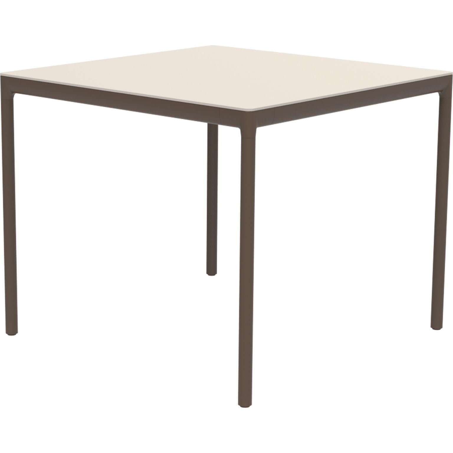 Ribbons bronze 90 table by MOWEE
Dimensions: D90 x W90 x H75 cm.
Material: Aluminium and HPL top.
Weight: 16 kg.
Also available in different colors and finishes. (HPL Black Edge or Neolith top). 

An unmistakable collection for its beauty and