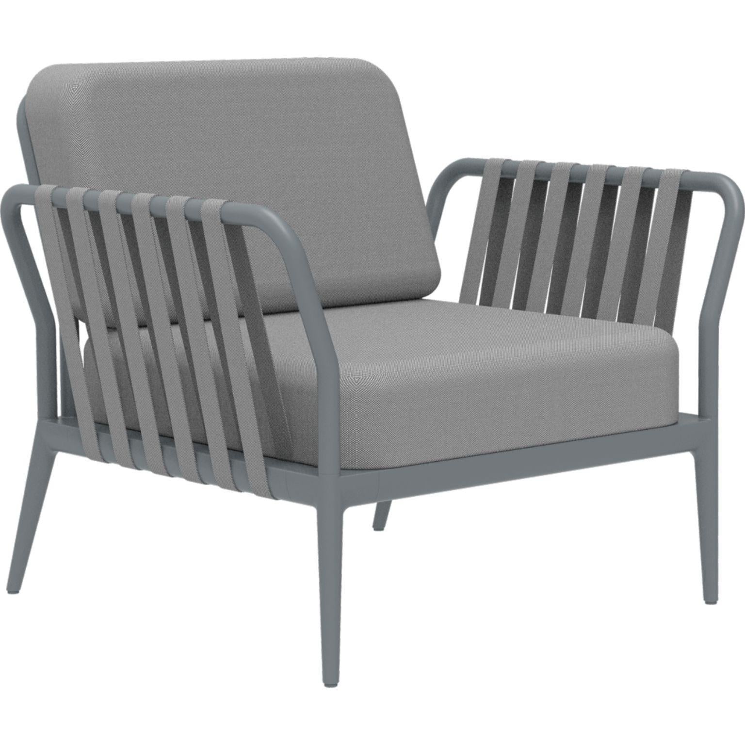 Ribbons grey armchair by Mowee.
Dimensions: D83 x W91 x H81 cm (Seat Height 42 cm).
Material: Aluminium, upholstery.
Weight: 20 kg
Also Available in different colours and finishes.

An unmistakable collection for its beauty and robustness. A