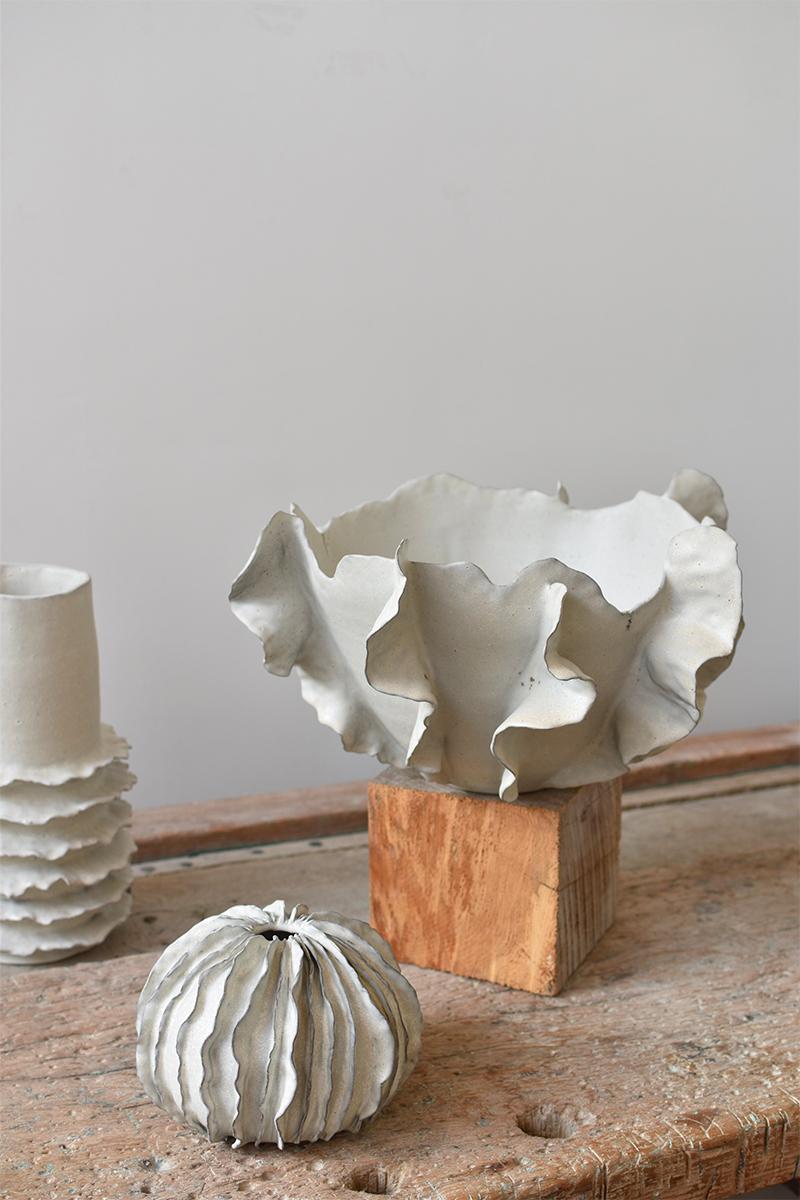 Beautiful large centerpiece bowl crafted from stoneware clay. Inspired by the vibrant marine life of the reef and the soft motion of ocean waves, this extra large fruit bowl showcases a distinctive blend of artistry and nature, capturing the
