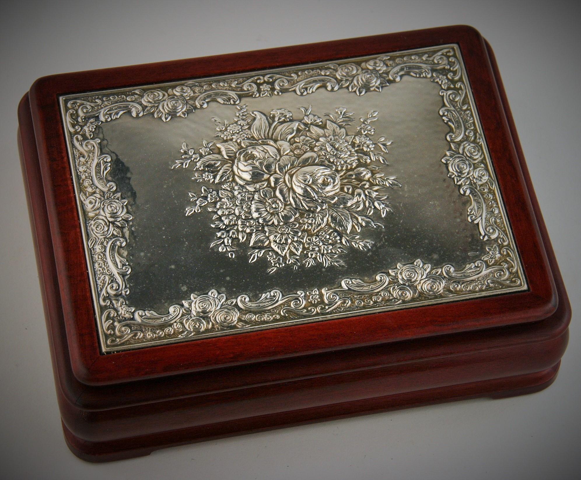 8-246 Italian wood jewelry box with silvered floral design top.
Red velvet interior with place for rings or cufflinks
Silver plaque signed Ricardi.