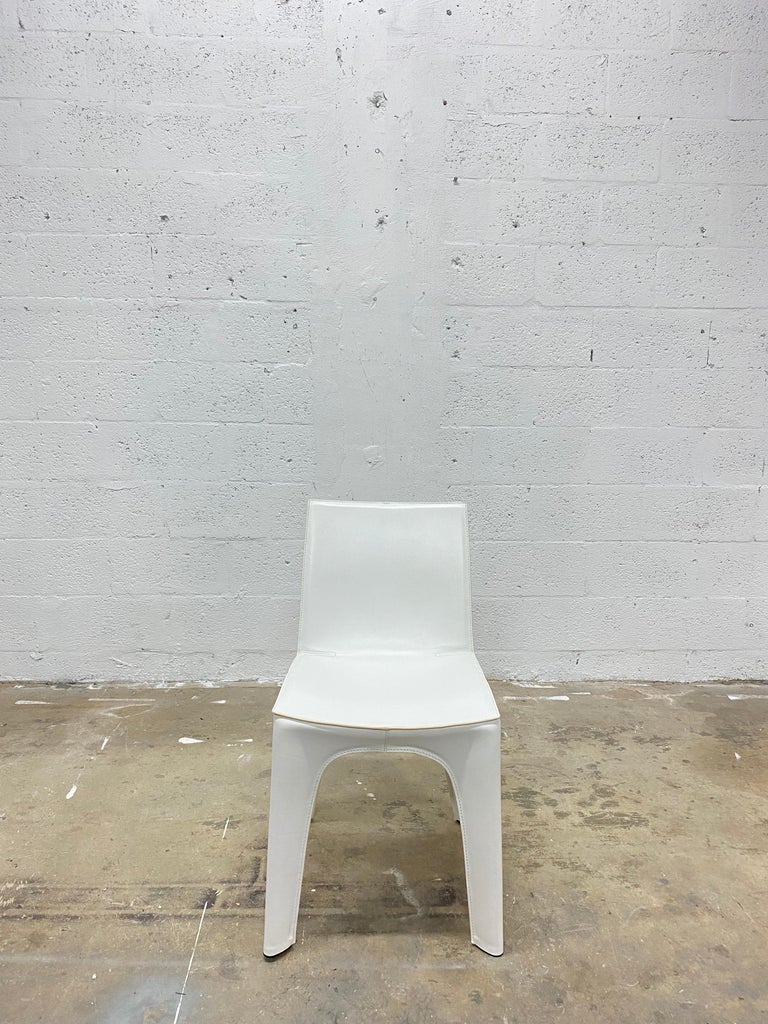 Single matte white BB dining or side chair made with a light expended polyurethane frame and leather exoskeleton. Designed by Riccardo Blumer & Matteo Borghi and manufactured by Poliform, 2009.