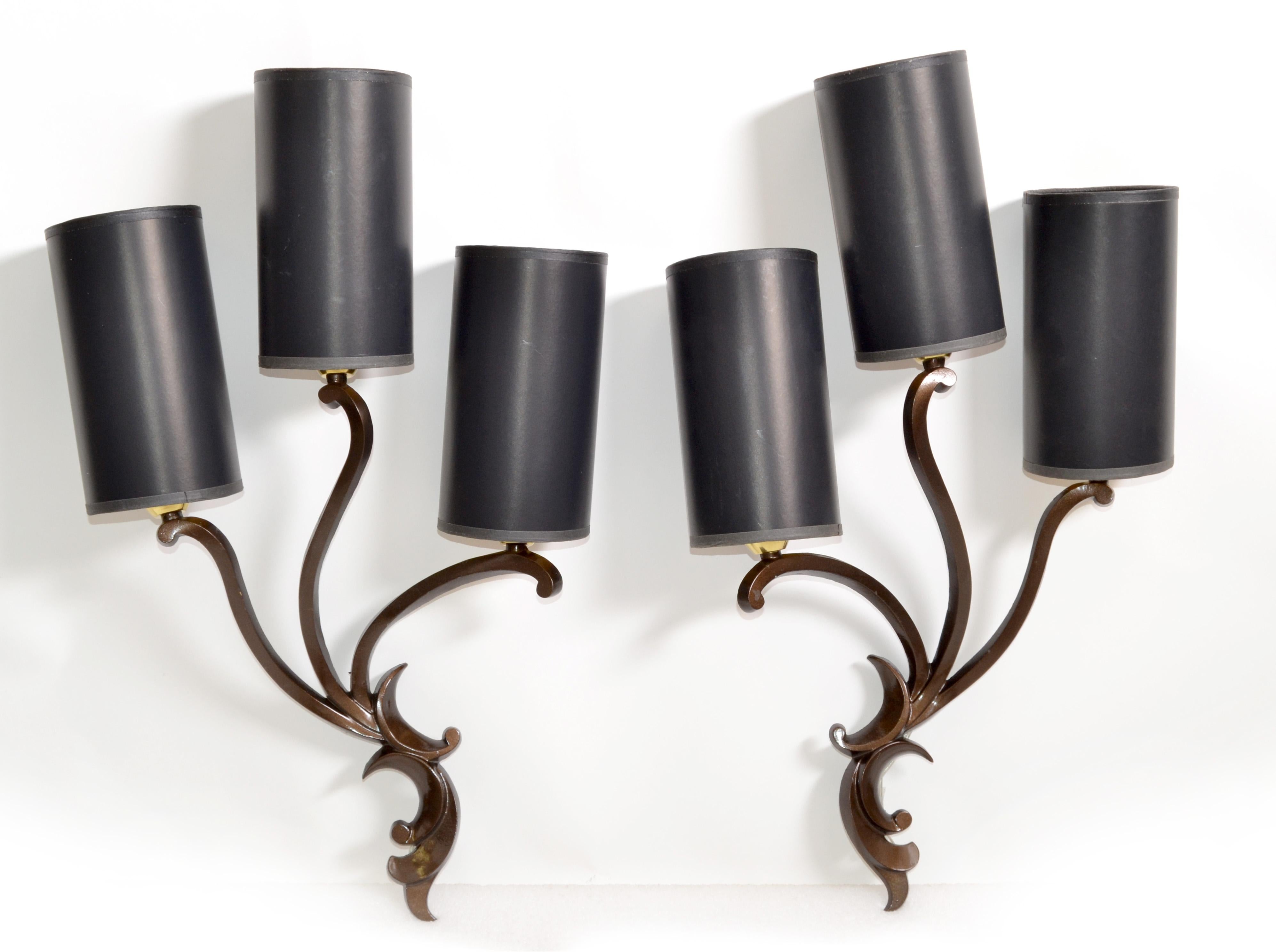 Superb pair of Italian Art Deco bronze sconces, wall lights designed by Riccardo Scarpa in the late 1950s.
They come with custom-made black & gold cylinder paper shades.
US rewired and in working condition each Sconce takes 3 light bulbs with max.