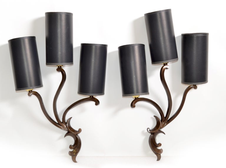 Superb pair of Italian Art Deco bronze sconces, wall lights designed by Riccardo Scarpa in the late 1950s.
They come with custom-made black & gold cylinder paper shades.
US rewired and in working condition each Sconce takes 3 light bulbs with max.