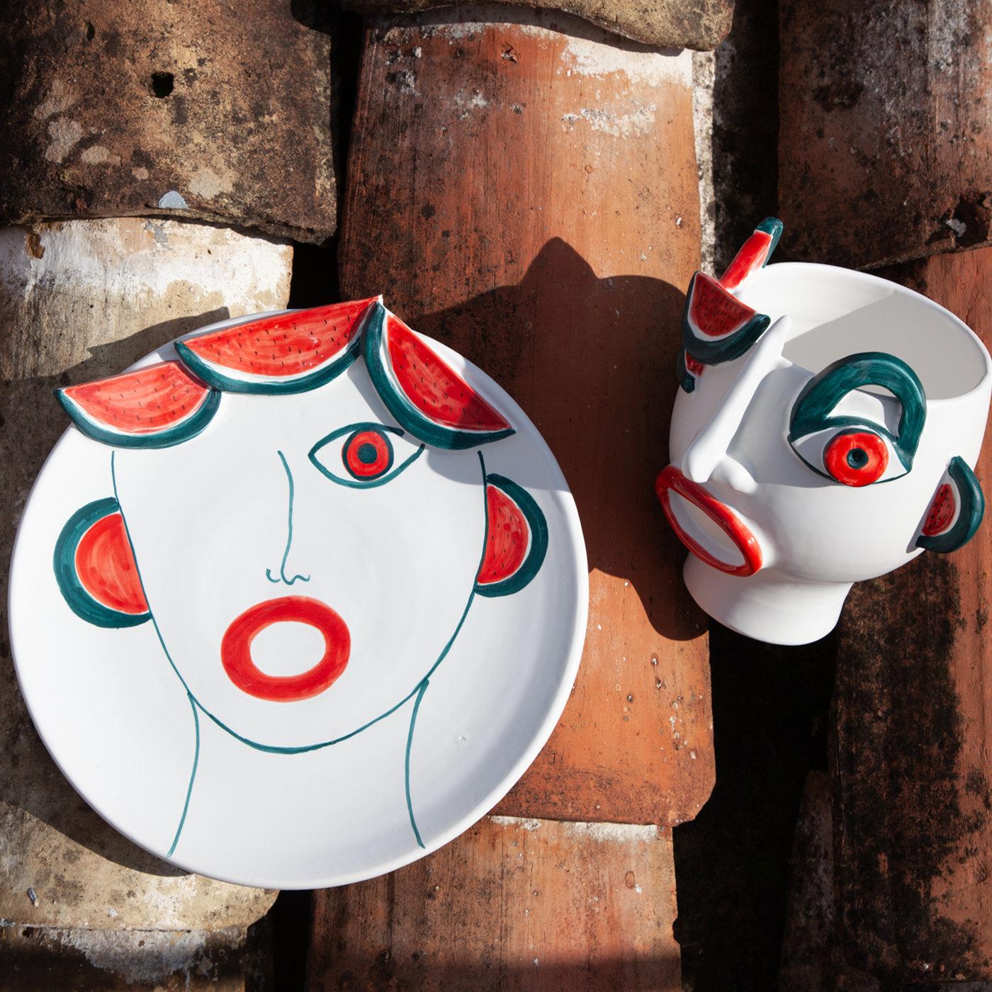 Master ceramist Patrizia Italiano drew inspiration from Sicilian local market sellers for her one-off series of stunning anthropomorphic ceramic vessels. Playful and intense, this head-shaped vase depicts Riccardo - street watermelon vendor - as