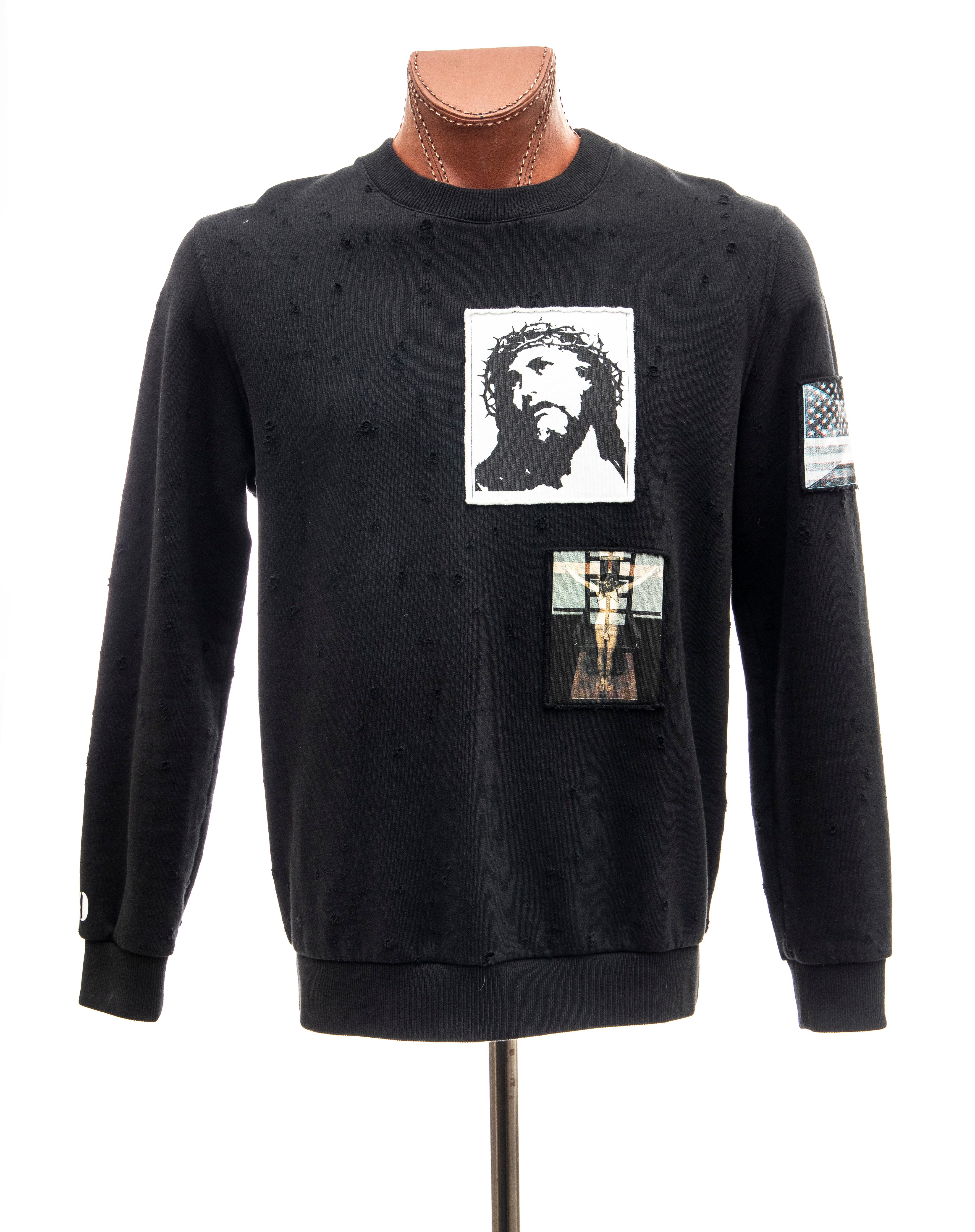 Riccardo Tisci for Givenchy, Spring 2016 Runway black distressed cotton sweatshirt with appliquéd patches,  crew neck and long sleeves .

EU. Small

Chest: 44, Waist: 40. Shoulder: 18.5, Sleeve: 26, Length: 29