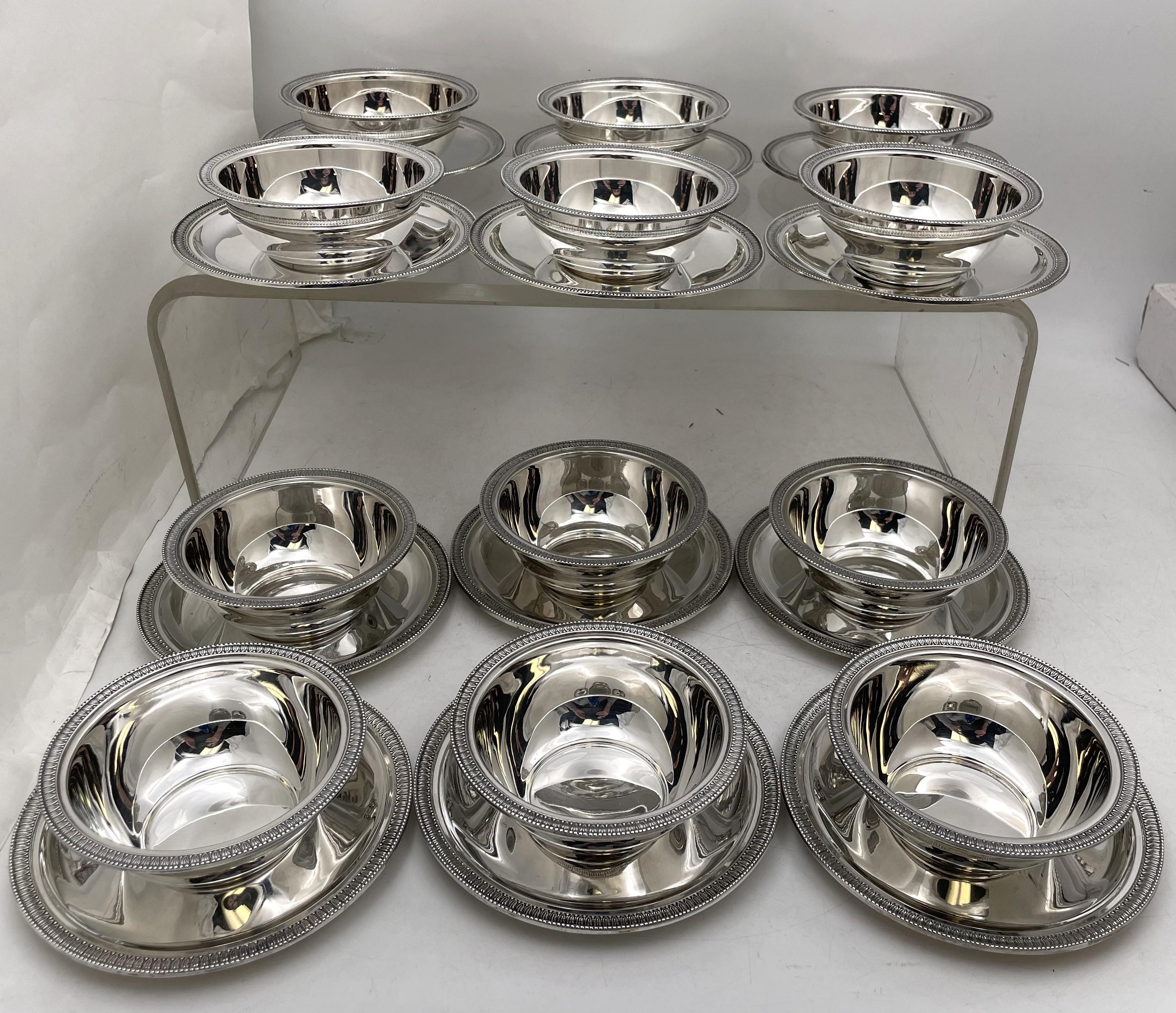 Italian continental silver set of 12 dessert / compote bowls with 12 matching underplates, with a beautiful, curvilinear design, and rims adorned with stylized geometric motifs, made by Ricci, active since 1840, between 1944 and 1968 in Alessandria,