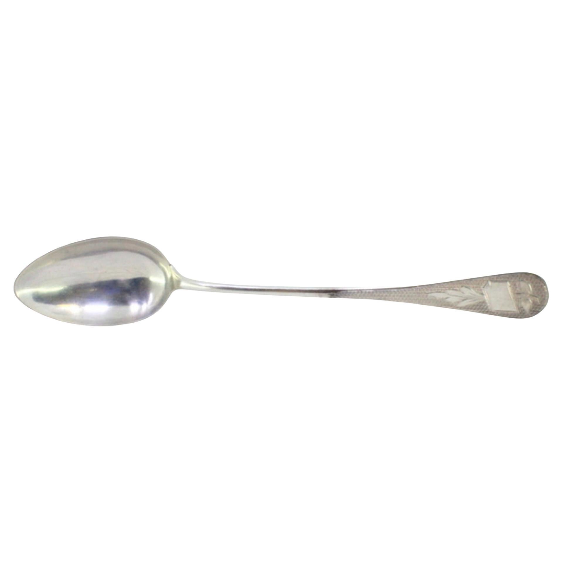 Rice and serving spoon in guilloche silver with a monogrammed card on the handle