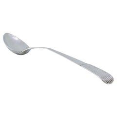 Rice and serving spoon in smooth silver with fluted handle