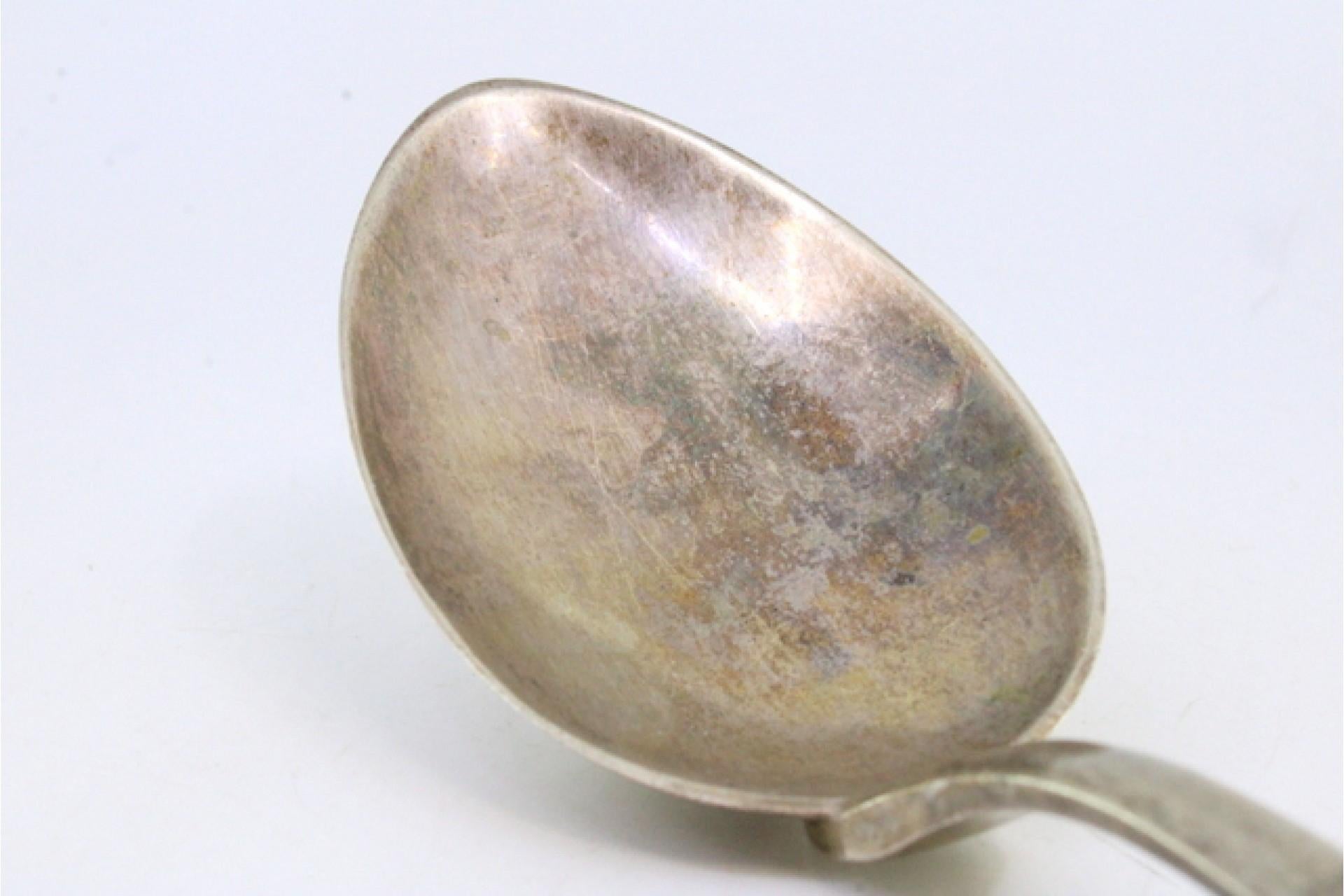 Rice spoon and serving with reliefs and grooves on the handle Silver en venta