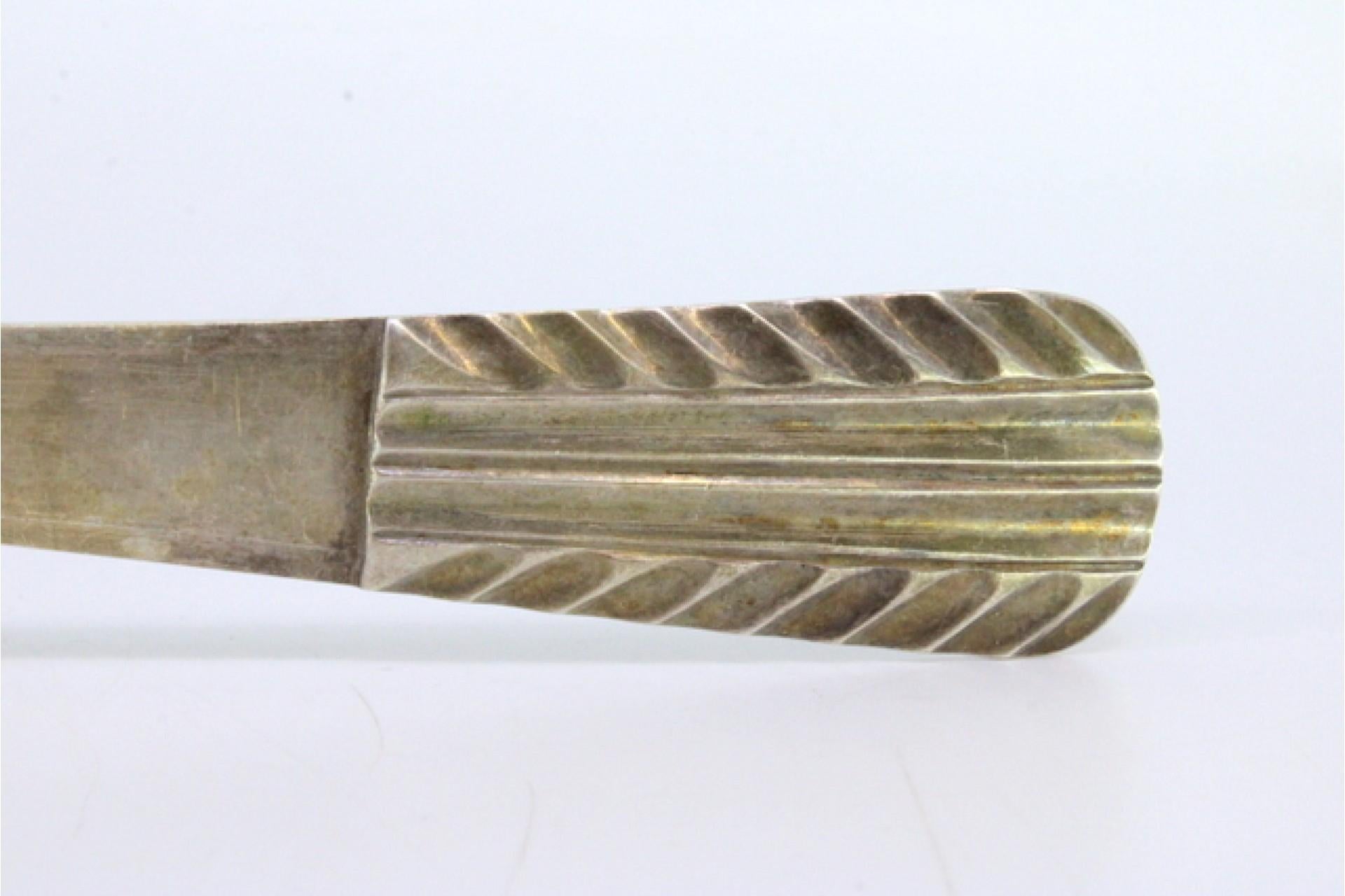 Rice spoon and serving with reliefs and grooves on the handle en venta 1